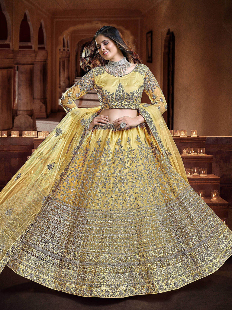 Fascinating Yellow Sequins Embroidered Net Wedding Wear Lehenga Choli
