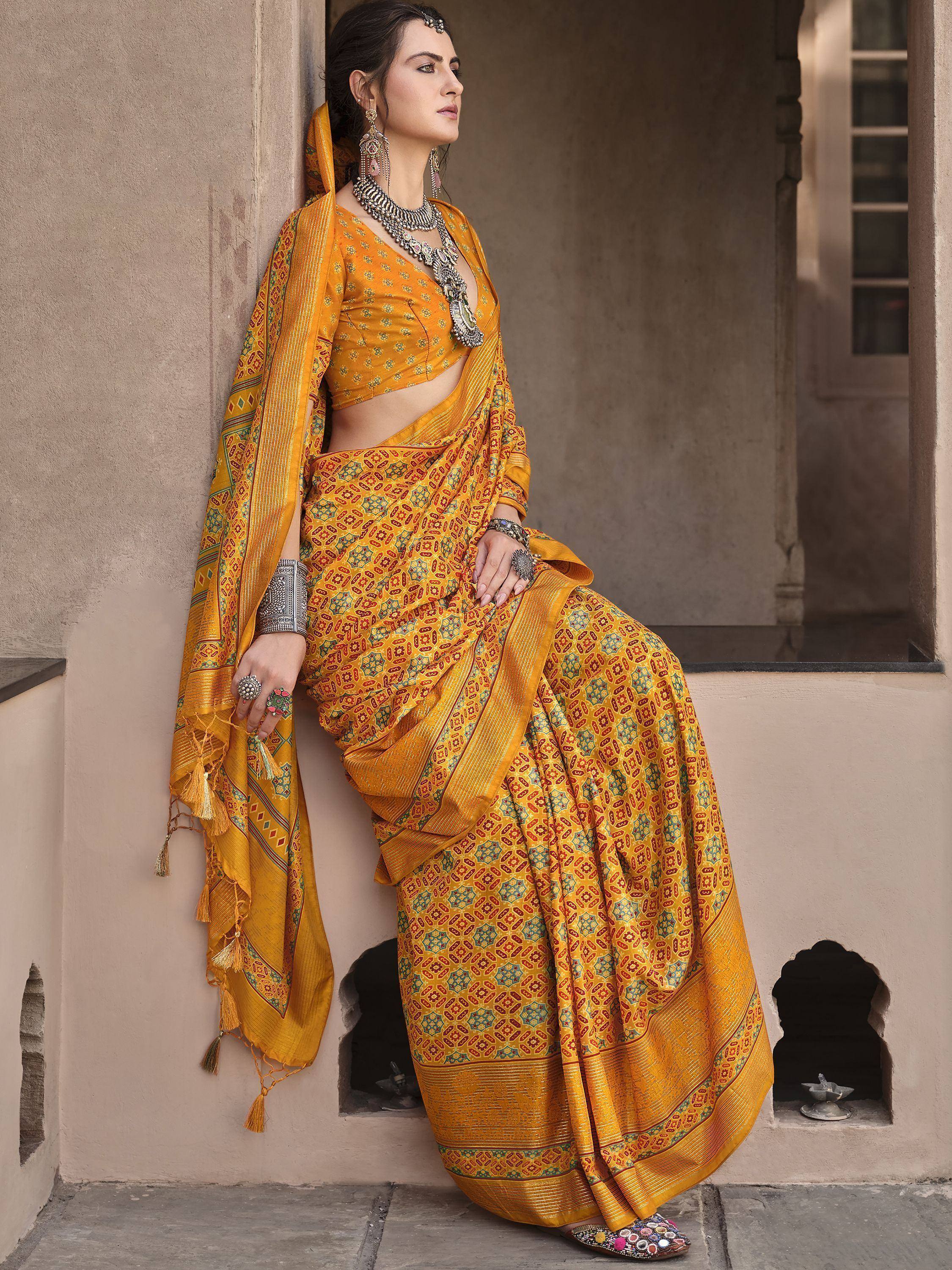 Yellow printed saree with blouse, ethnic jewelry, and traditional Indian attire for festive occasions