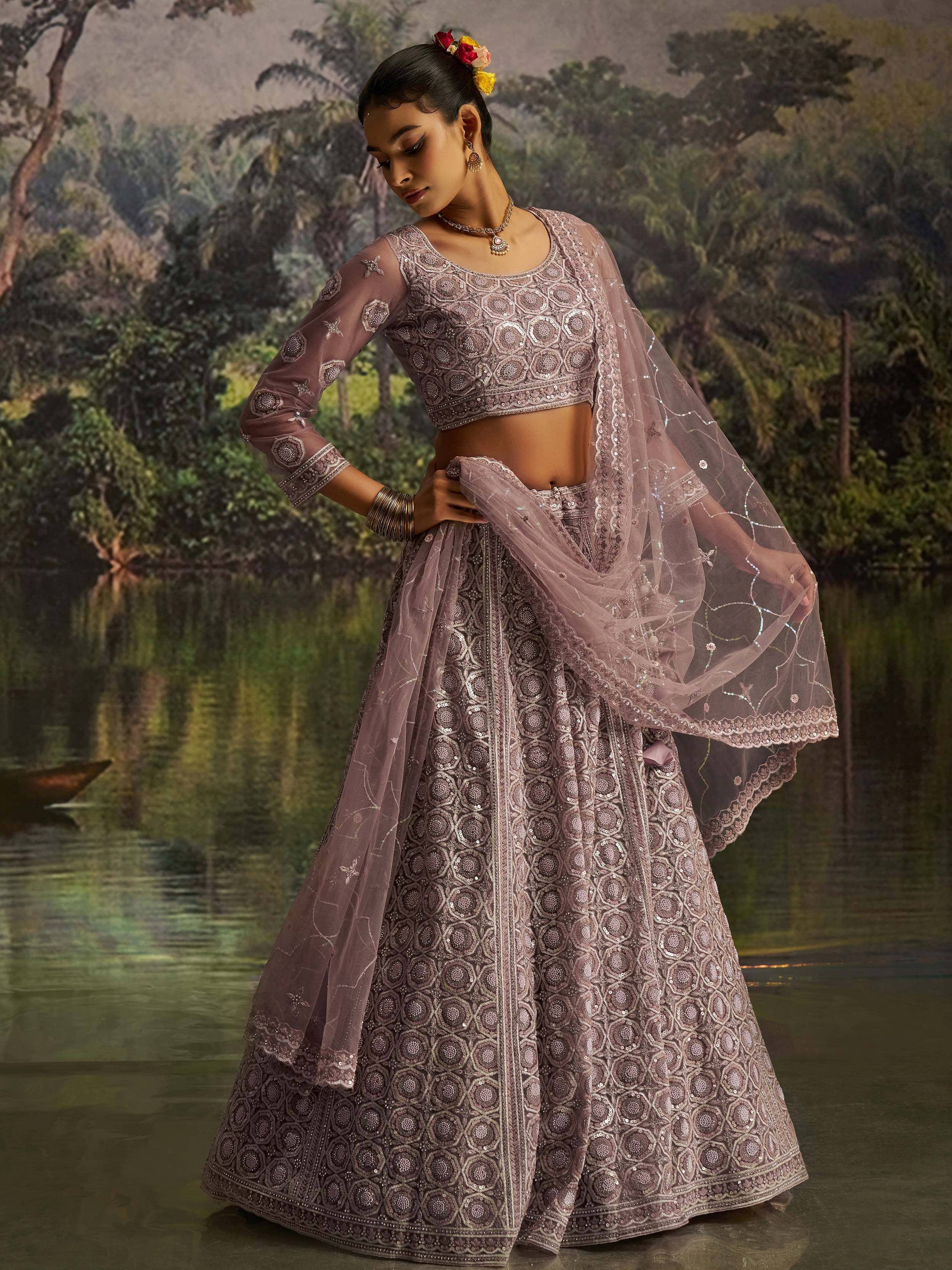 Elegant mauve lehenga choli with intricate embroidery, perfect for Indian weddings and festive occasions.