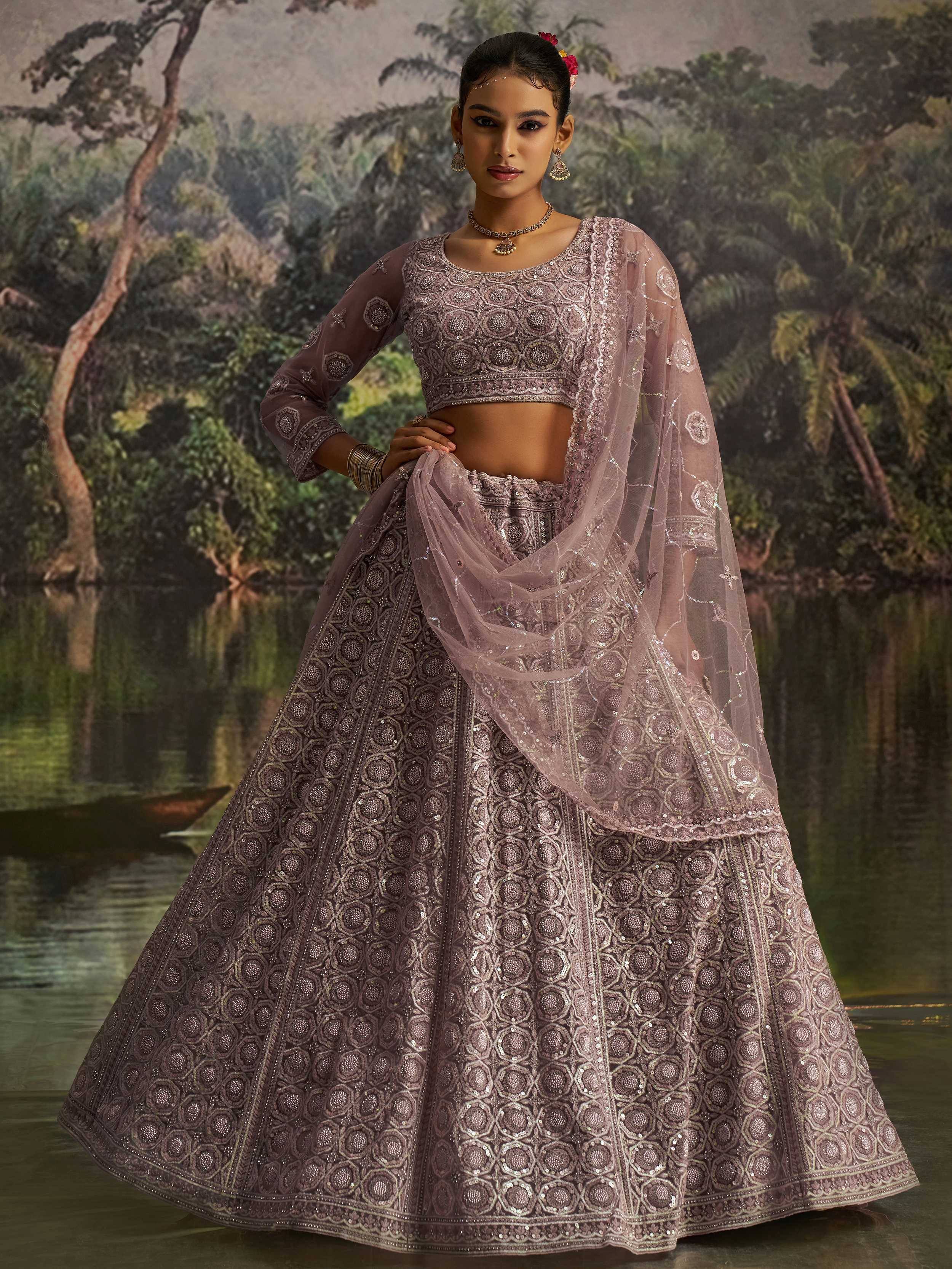 Elegant mauve lehenga choli with intricate embroidery and sheer dupatta, perfect for Indian ethnic wear occasions
