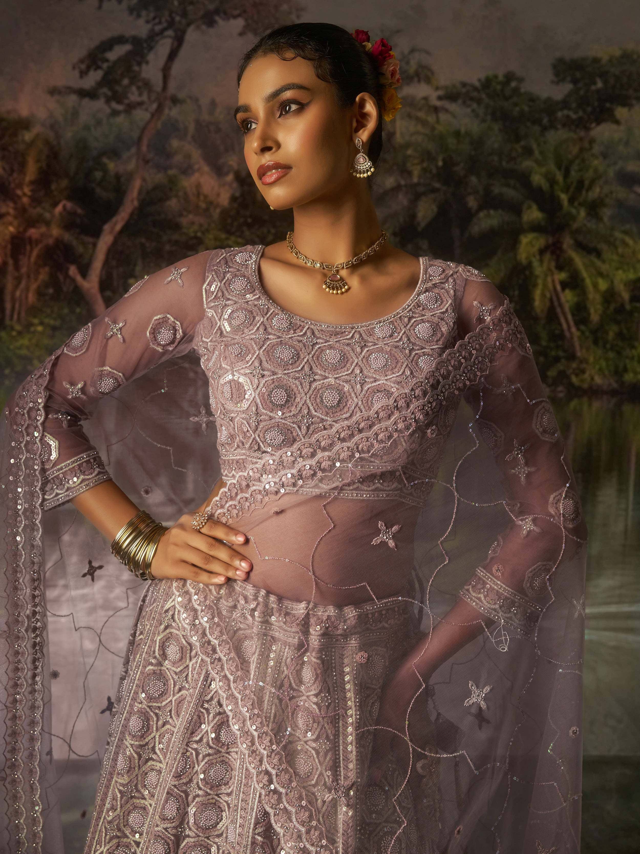 Elegant mauve embroidered lehenga choli with sheer sleeves, perfect for Indian ethnic wear occasions.