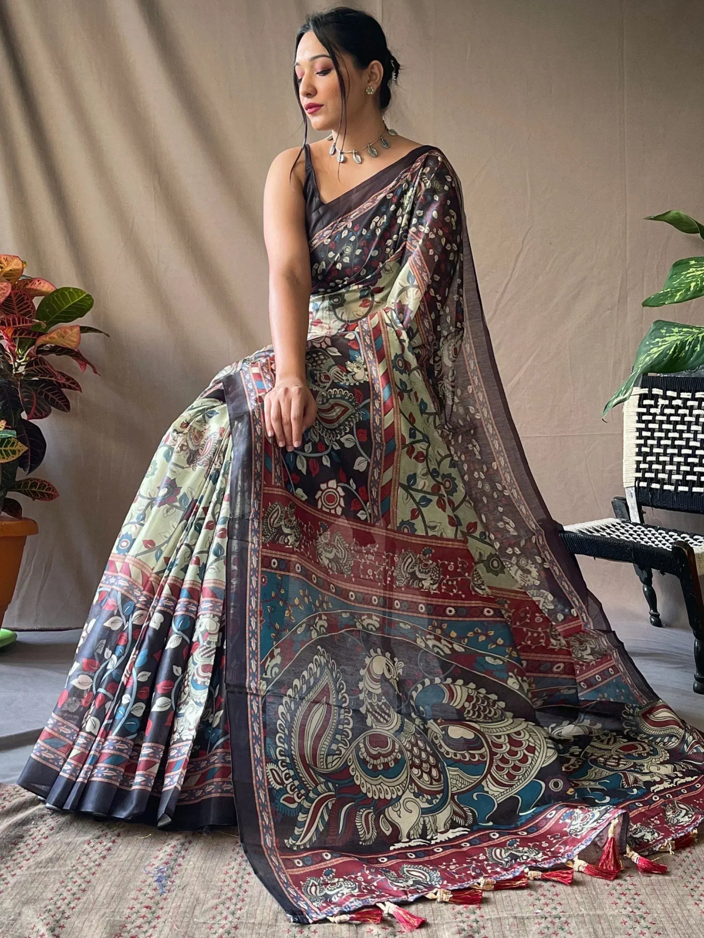 Woman in elegant printed saree with peacock motifs, ethnic Indian wear for festive occasions