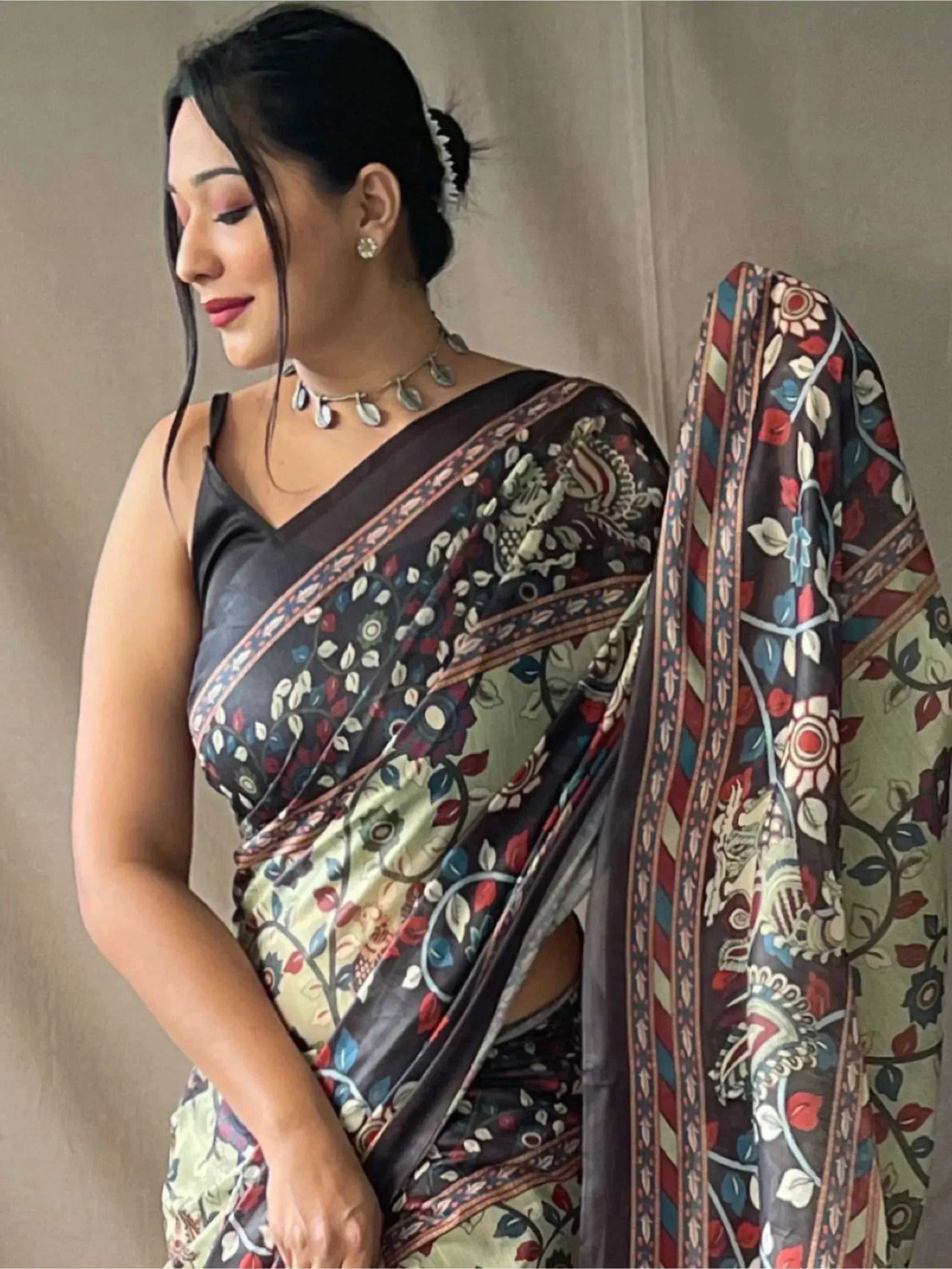 Woman in floral printed ethnic saree with designer blouse, perfect for Indian occasions and festivals.