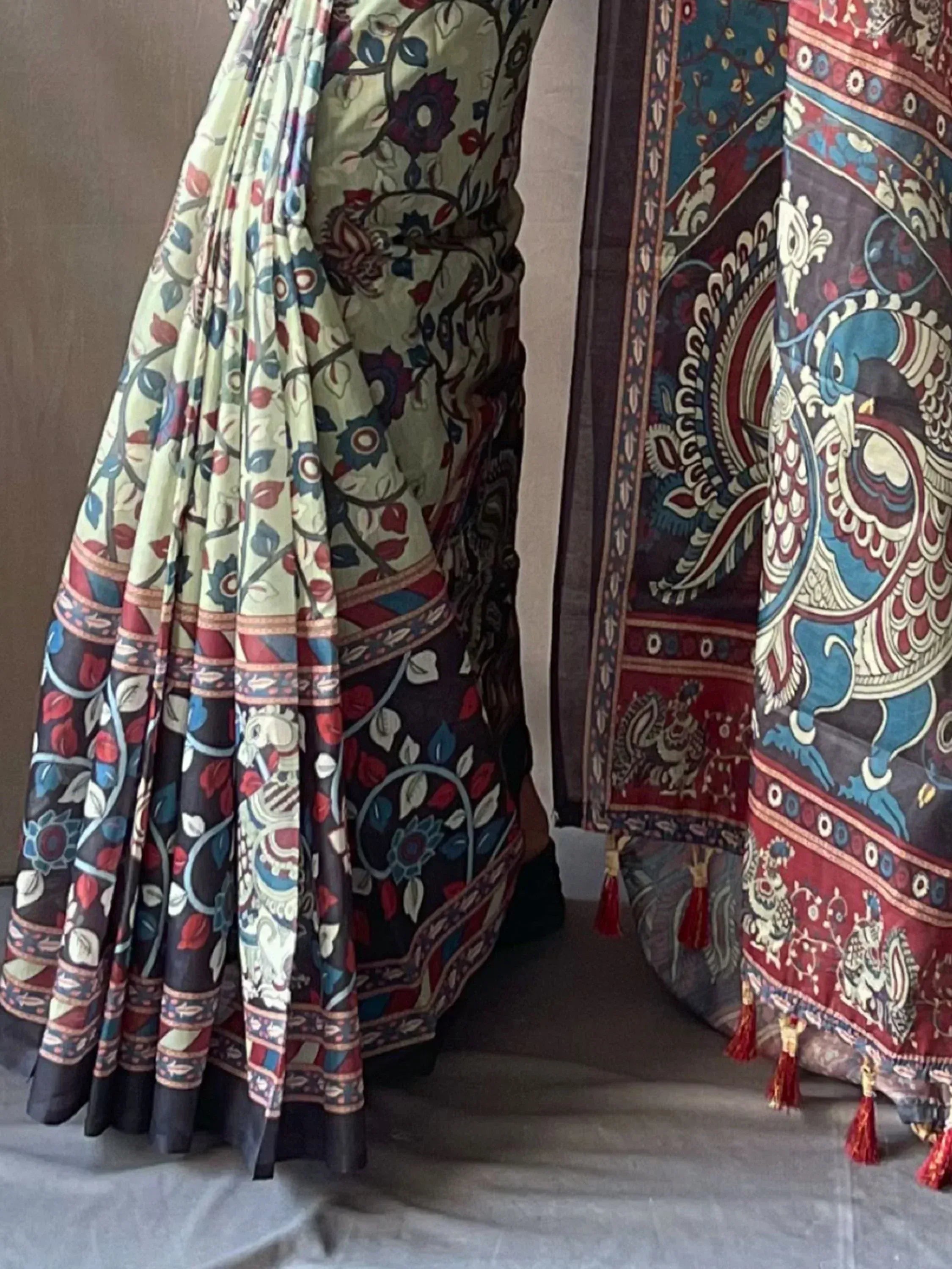 Floral and peacock print Indian ethnic sarees with tassels, perfect for traditional occasions.