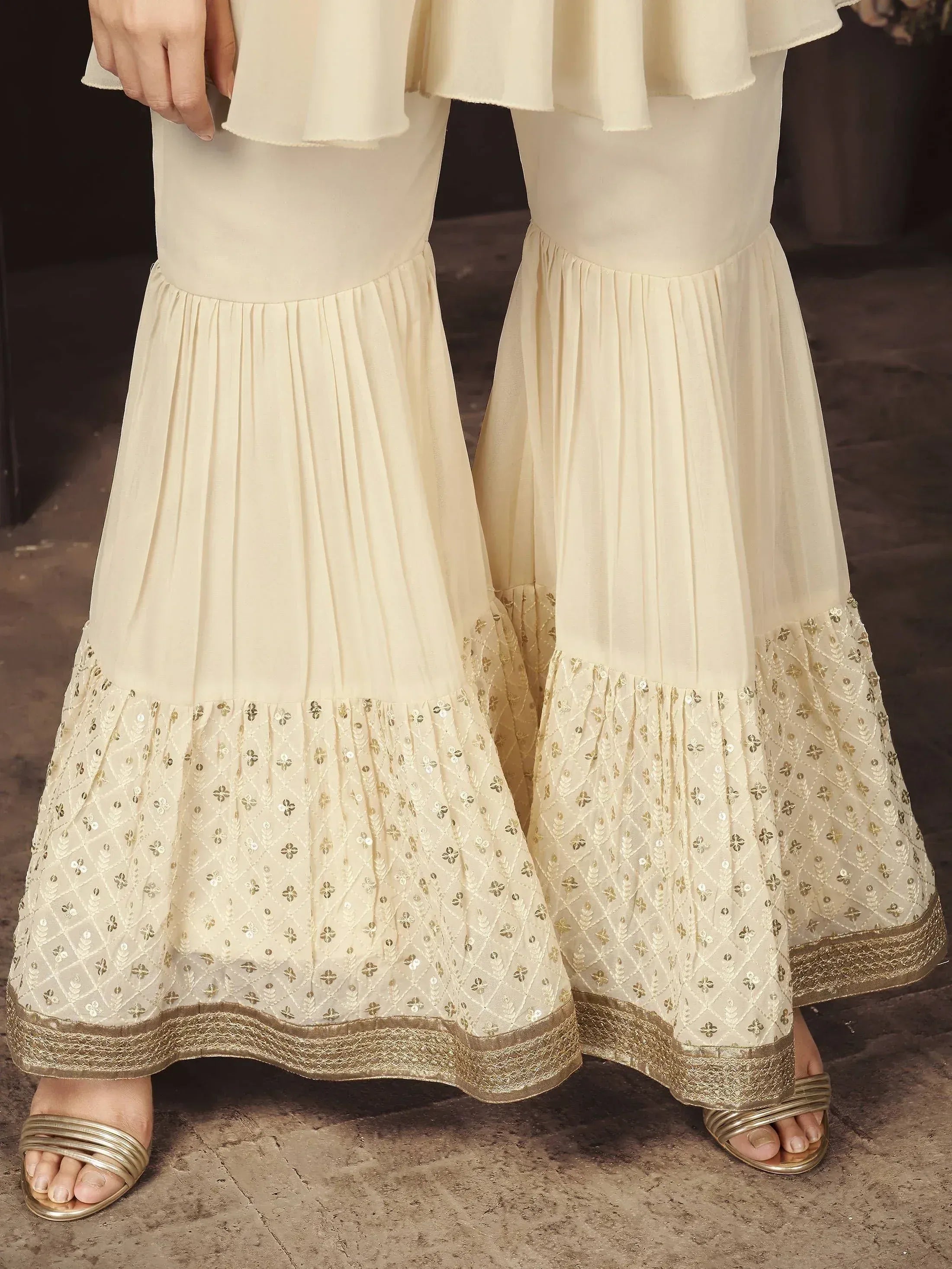 Cream embroidered sharara pants with gold border, traditional Indian ethnic wear