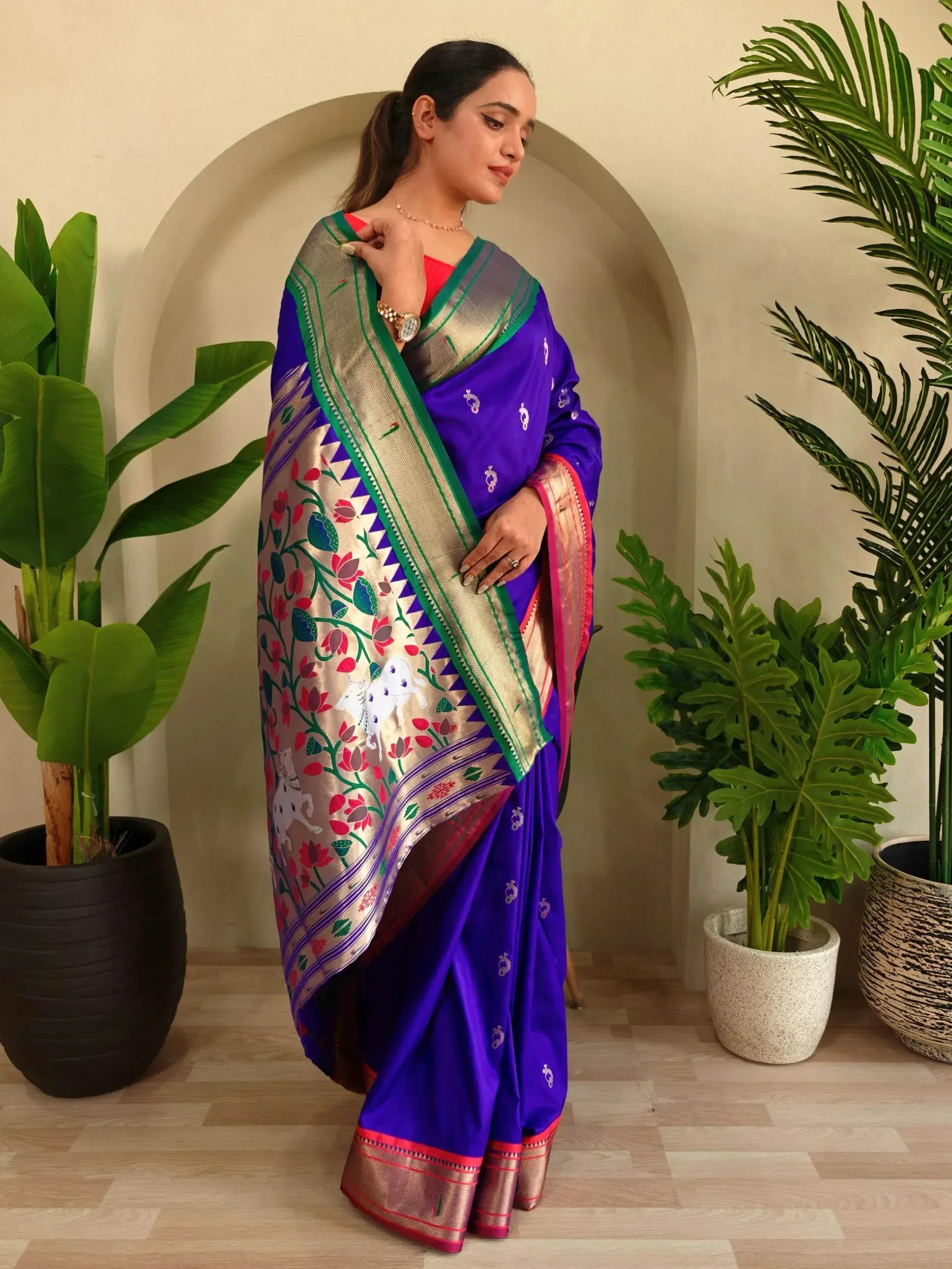 Purple designer saree with floral and elephant motifs, perfect for Indian ethnic wear occasions