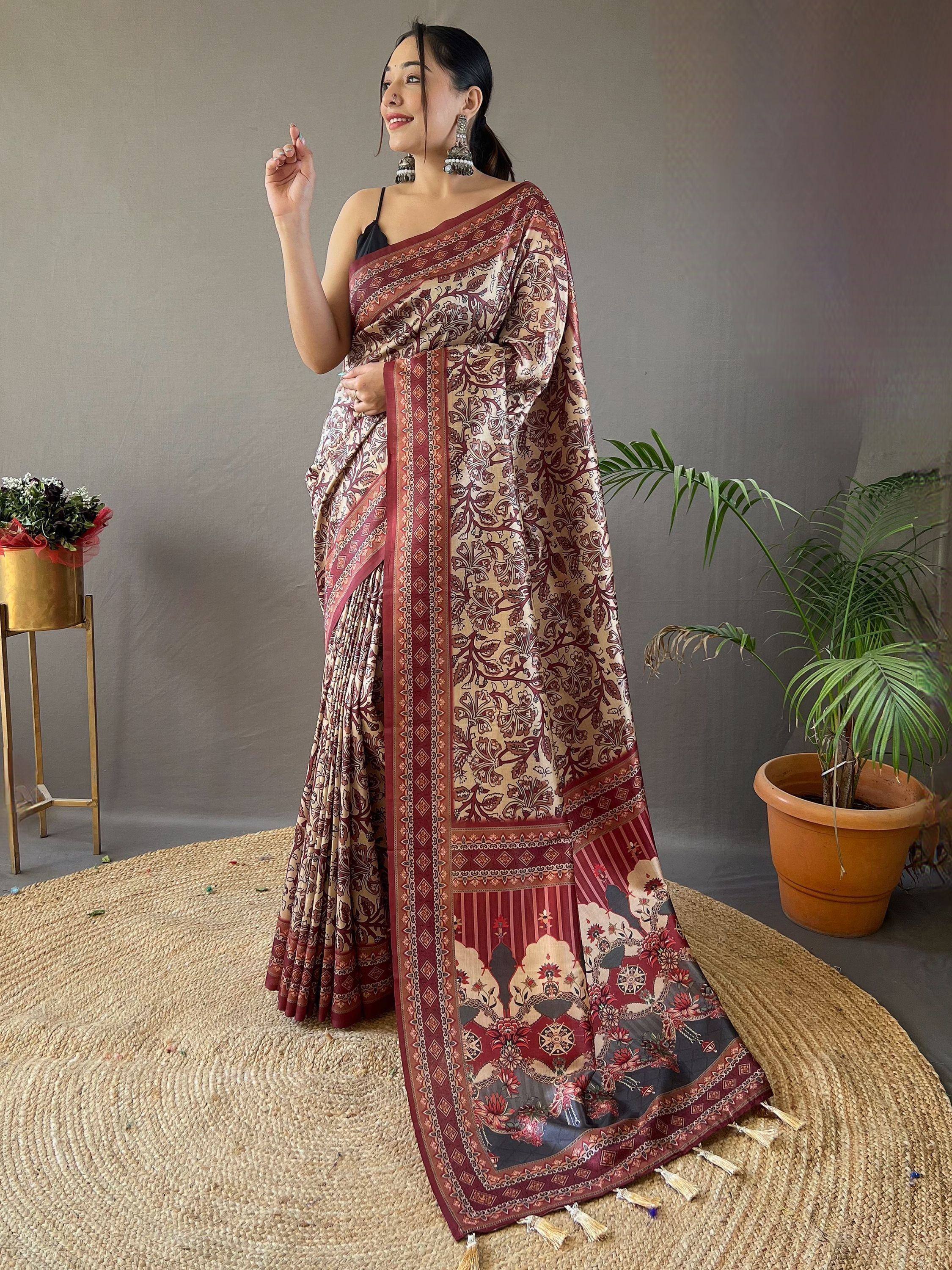 Woman in elegant maroon and beige printed saree with floral motifs, perfect for ethnic occasions
