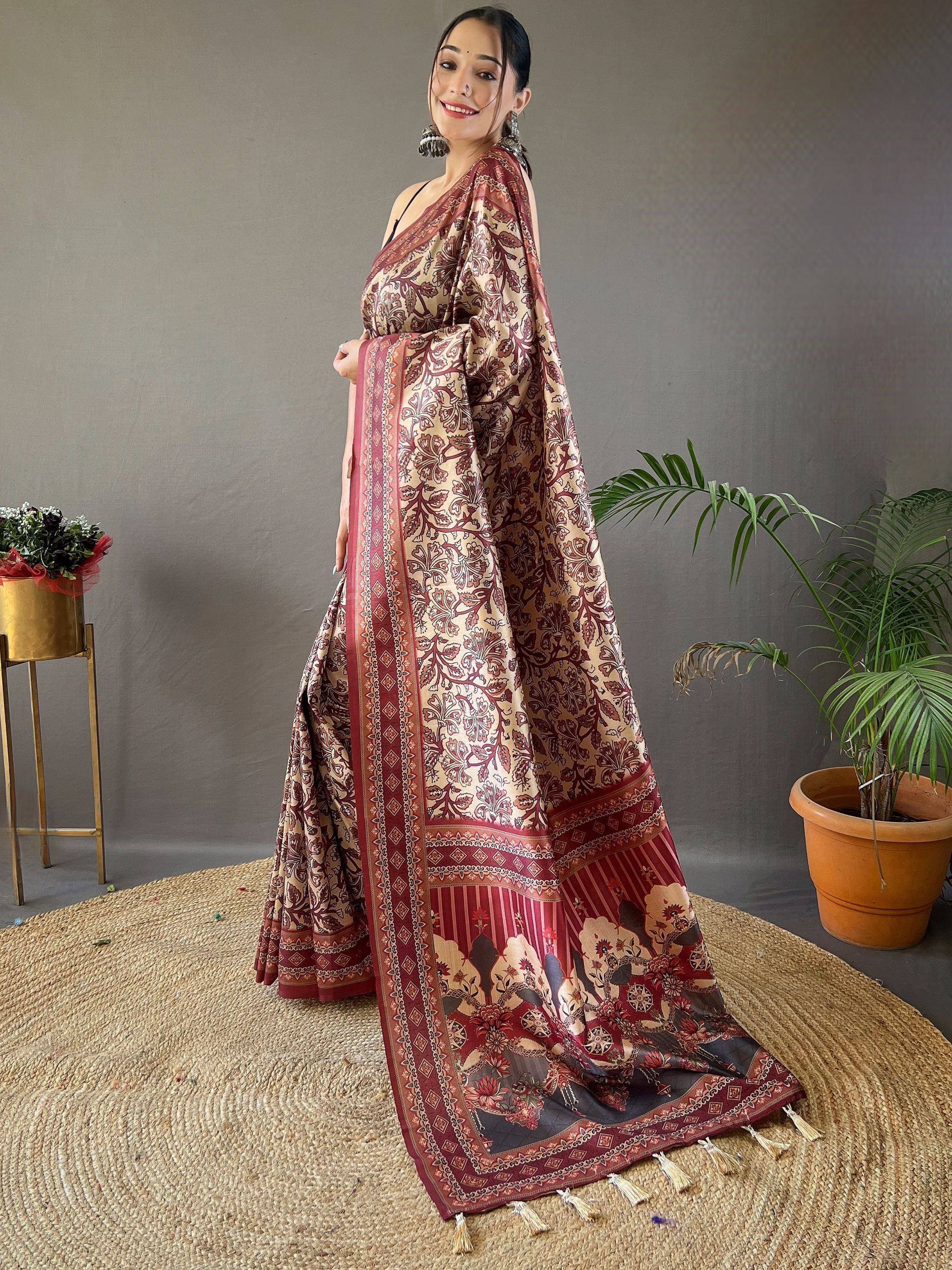 Woman in maroon and beige floral printed saree with tassels, styled for Indian ethnic wear