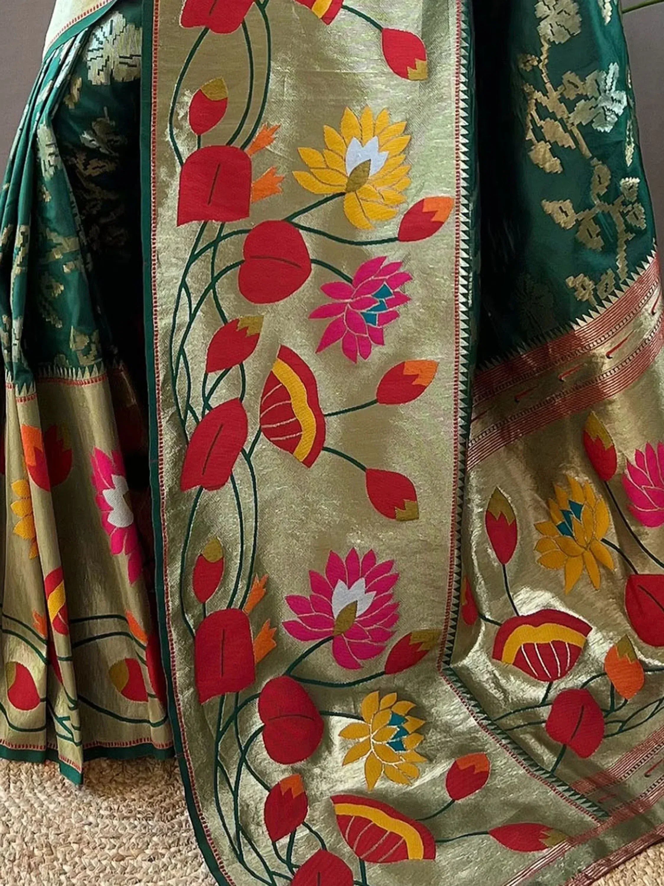 Vibrant floral embroidered saree with gold and green accents, perfect for ethnic wear.