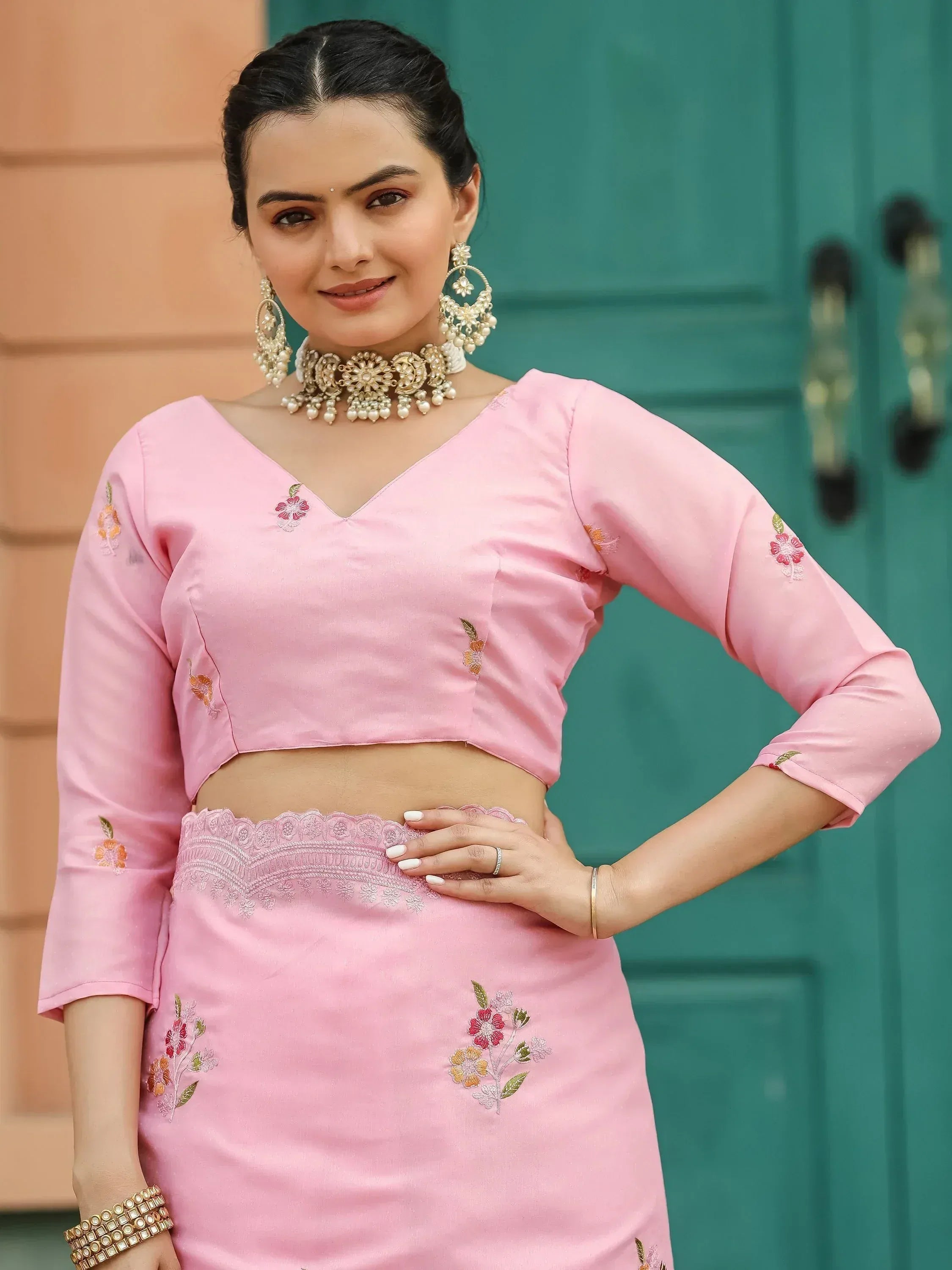 Pink embroidered lehenga choli with floral motifs, perfect for Indian ethnic wear occasions