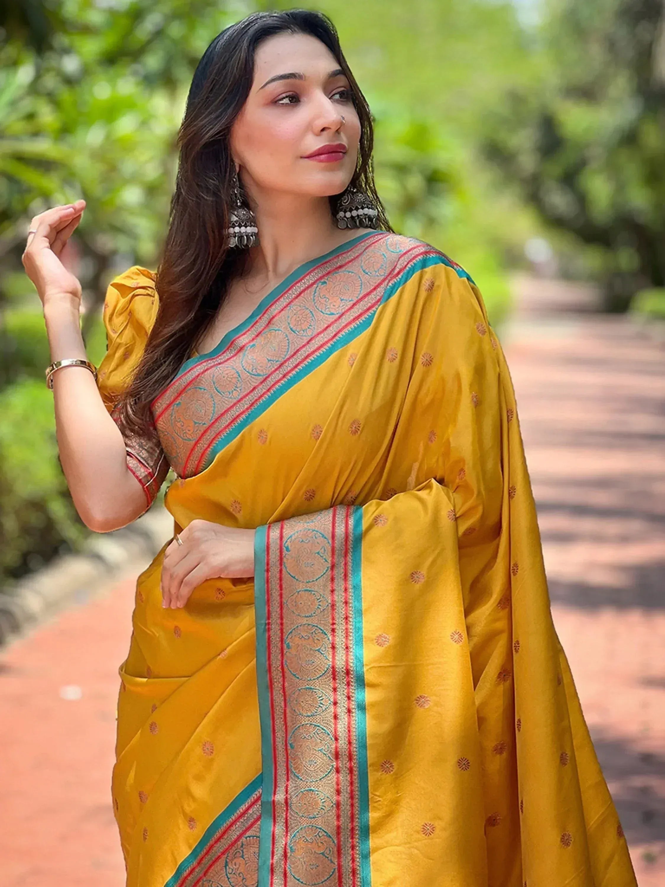 Yellow ethnic saree with blue and red border, perfect for Indian occasions and festivals