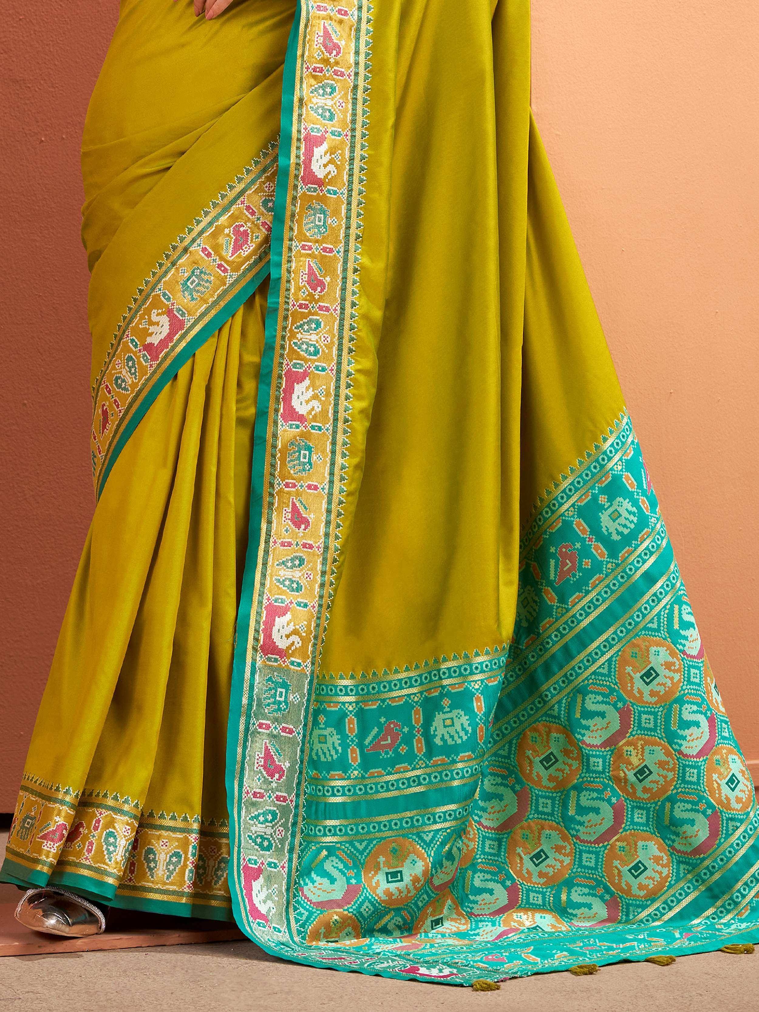 Mustard yellow saree with teal border, elephant & bird motifs, ethnic Indian wear