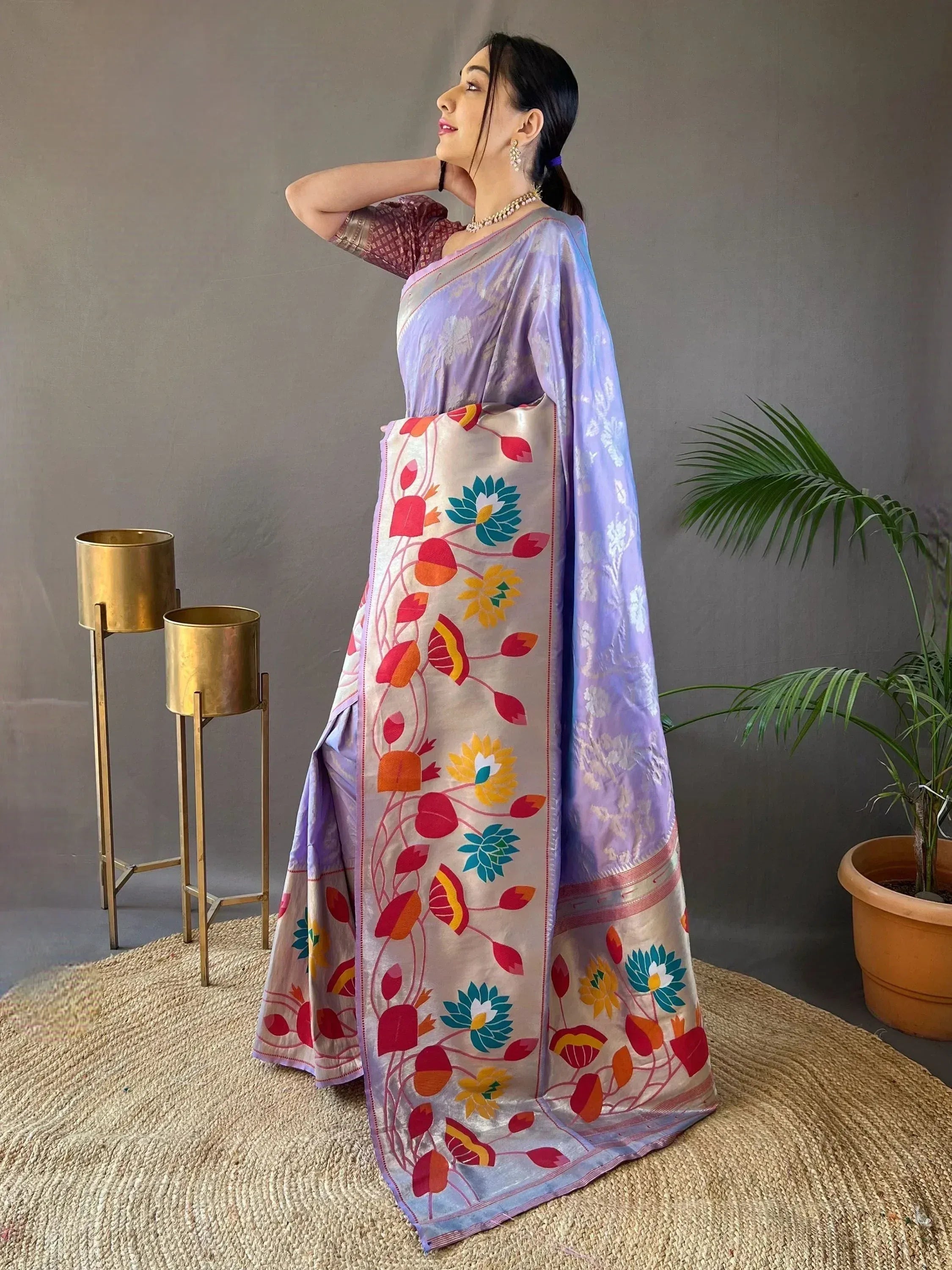 Purple floral saree with vibrant lotus print, paired with a maroon blouse, perfect for Indian ethnic occasions.