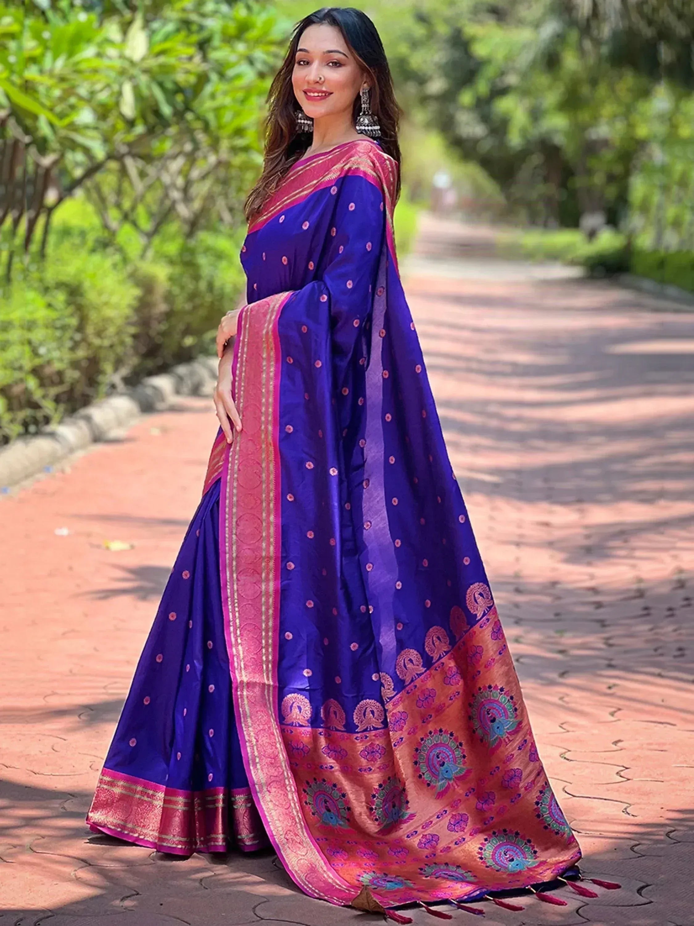 Royal blue saree with pink peacock border, perfect for Indian ethnic wear occasions