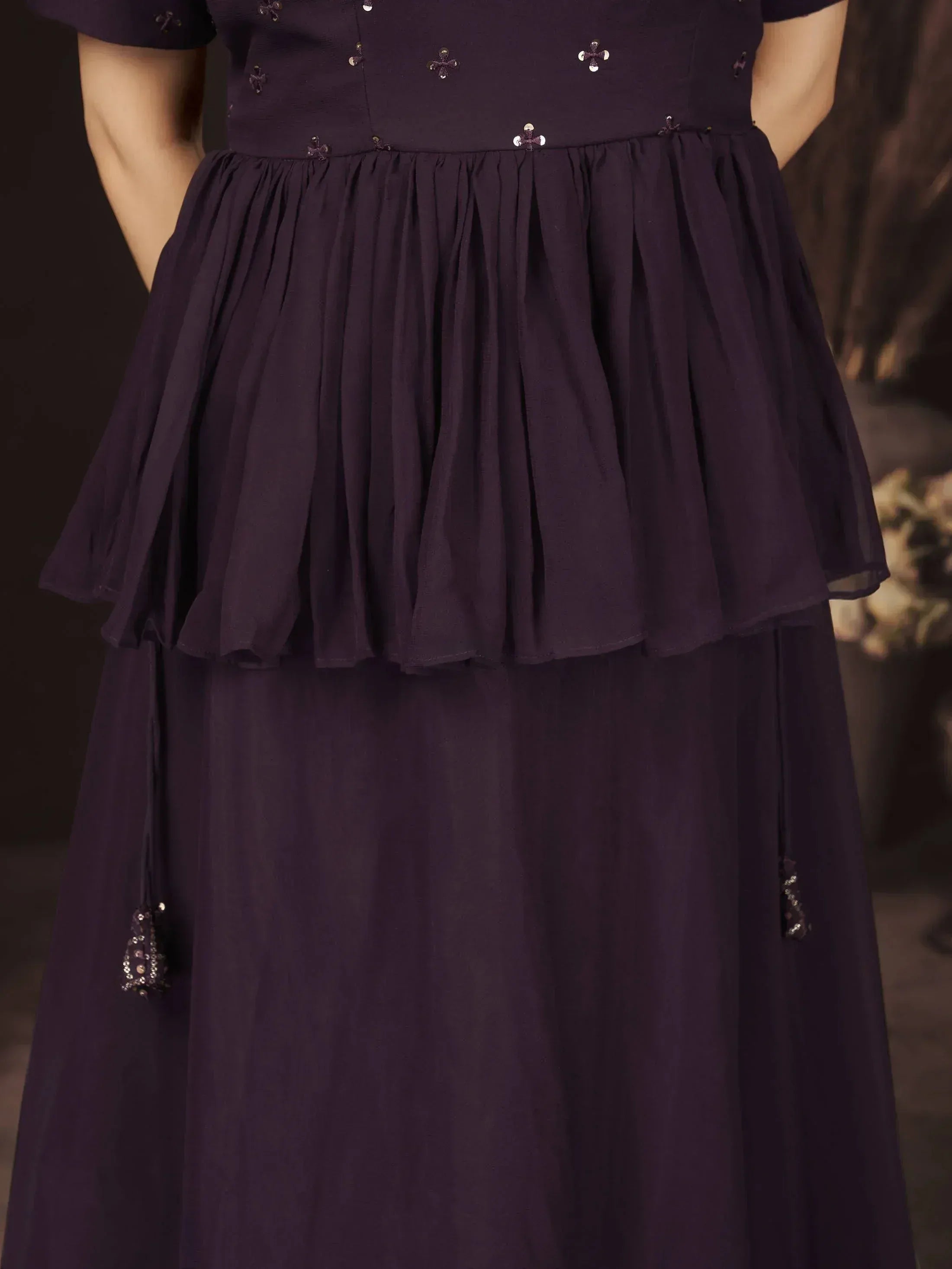 Purple ethnic gown with layered ruffle skirt and sequin embellishments