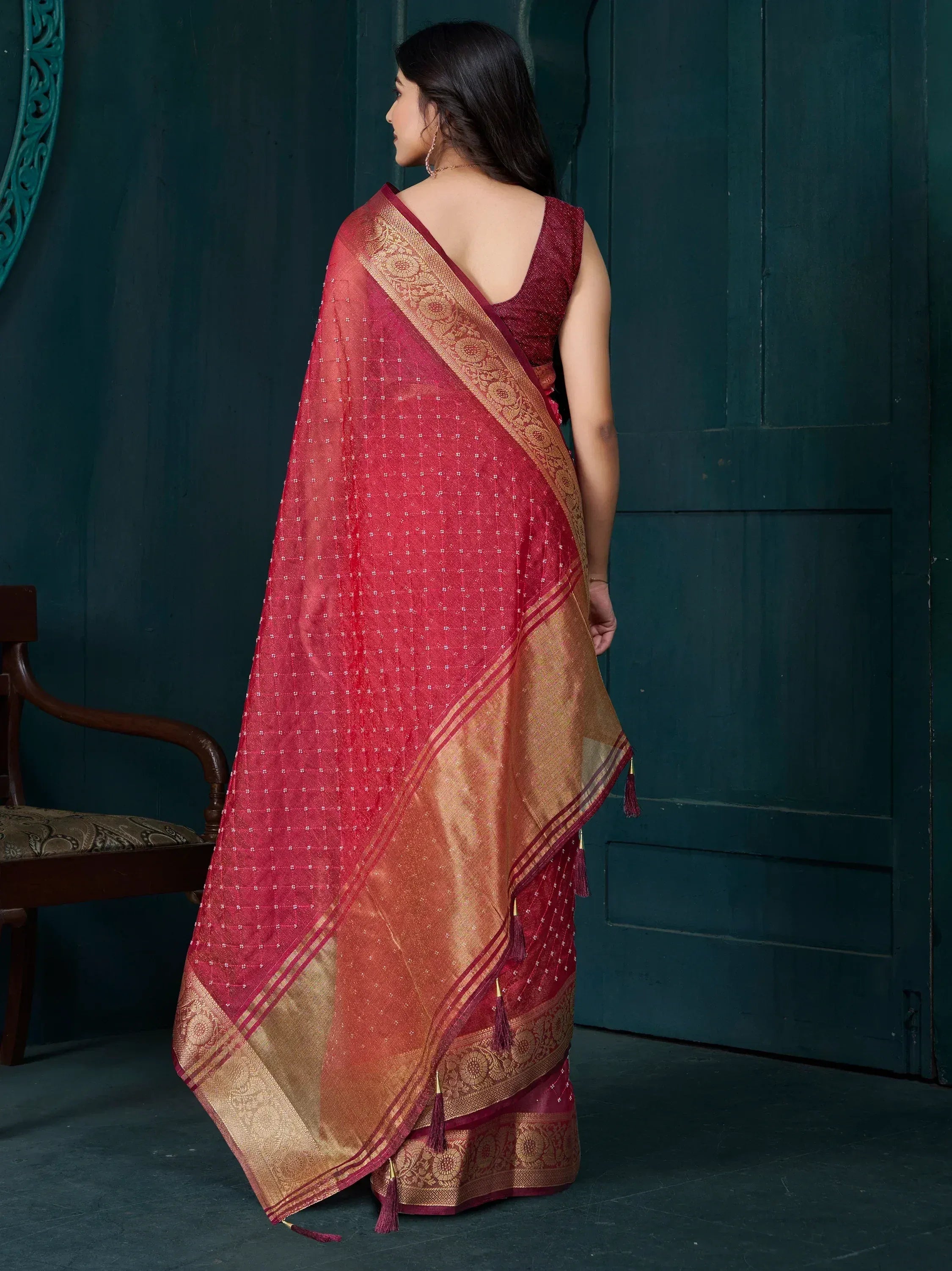 Elegant maroon saree with golden border and tassels, perfect for Indian ethnic wear