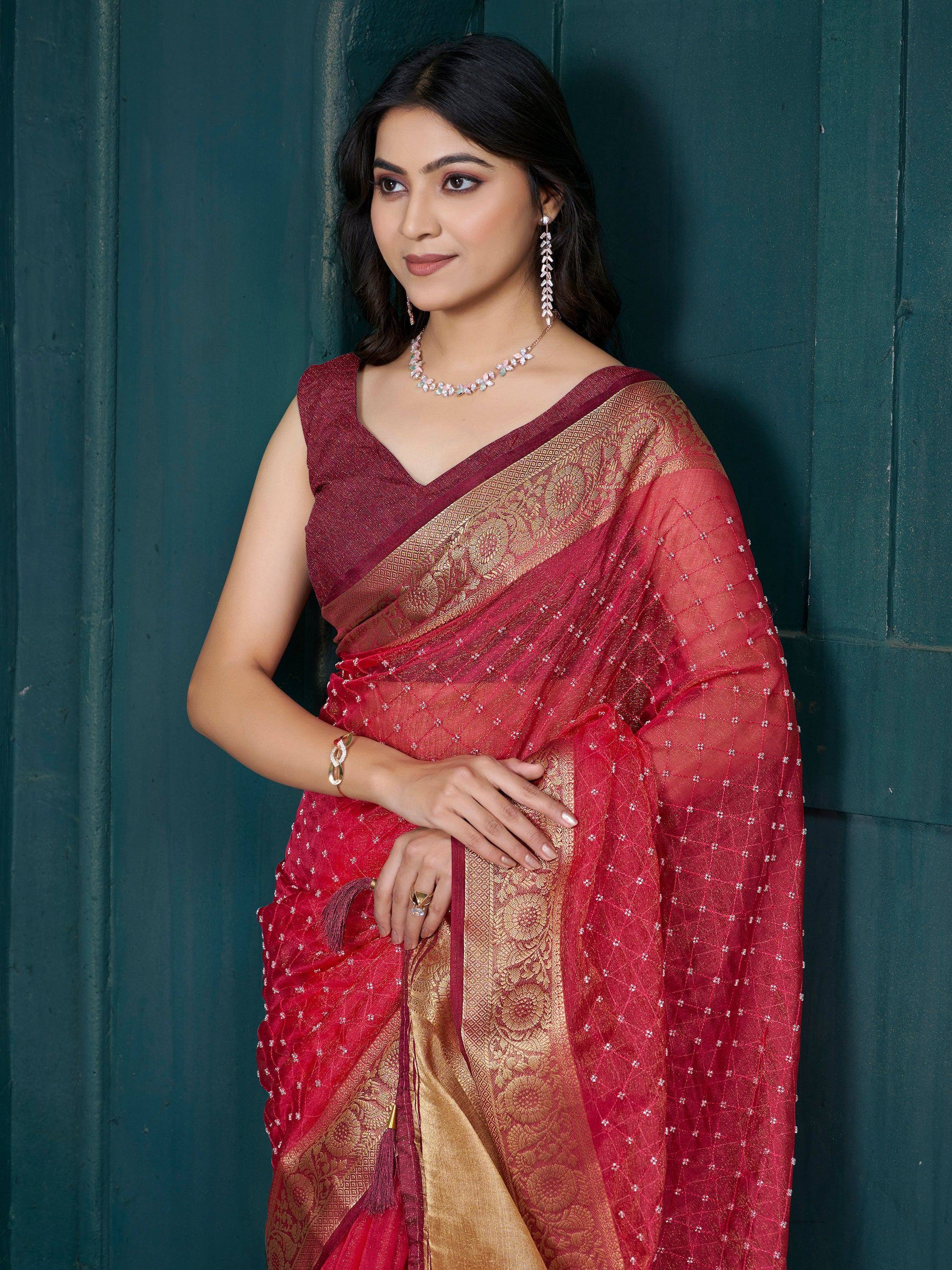 Elegant red and gold saree with intricate embroidery, perfect for Indian ethnic wear occasions.