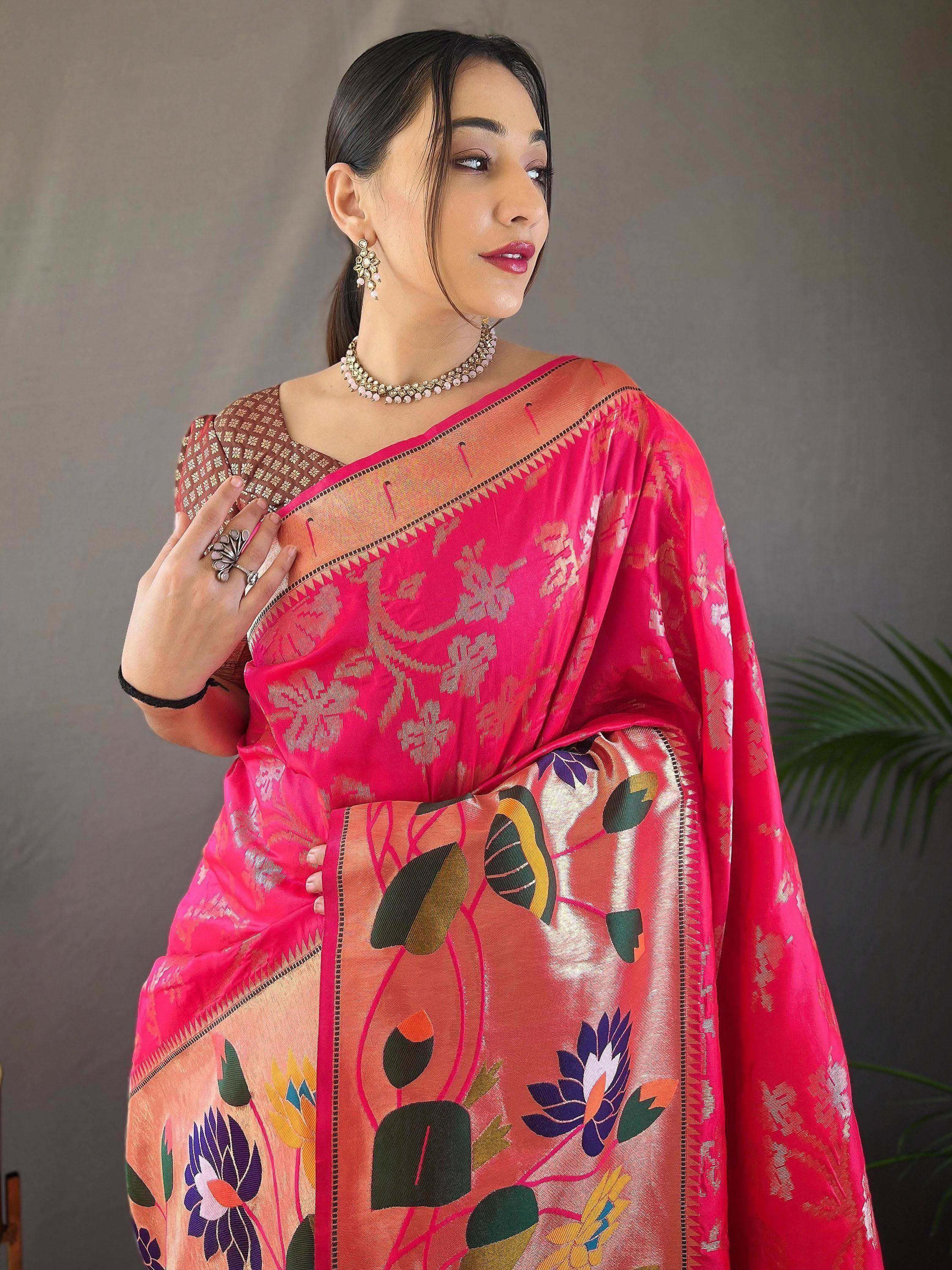 Vibrant pink floral saree with gold border, perfect for Indian ethnic wear occasions