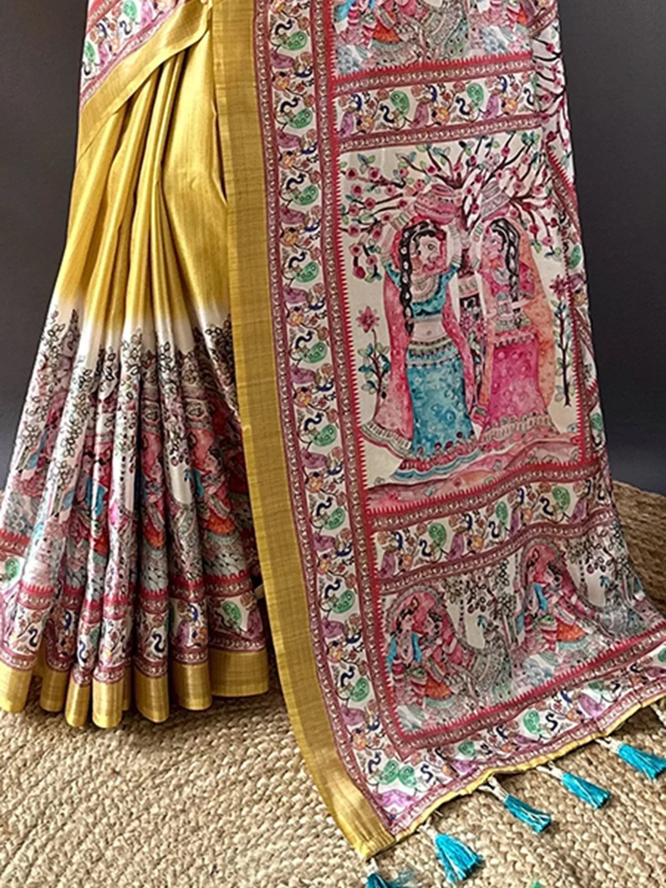 Vibrant Indian saree with intricate hand-painted designs and golden border, perfect for ethnic occasions.