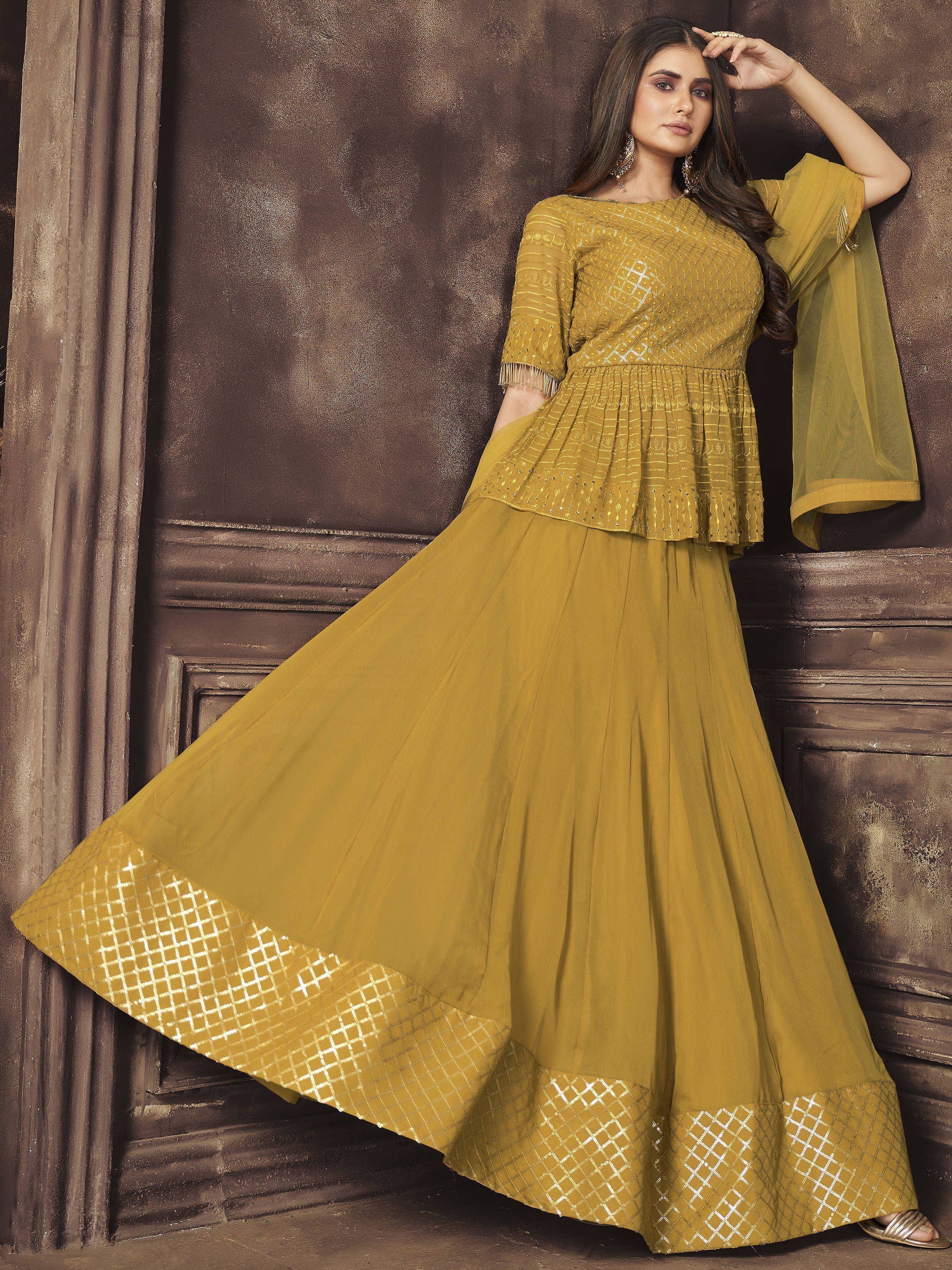 Mustard yellow ethnic gown with peplum top and geometric border, perfect for Indian occasions