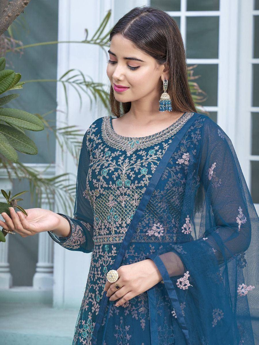 Blue embroidered ethnic gown with sheer sleeves, floral detailing, and matching dupatta for Indian occasions