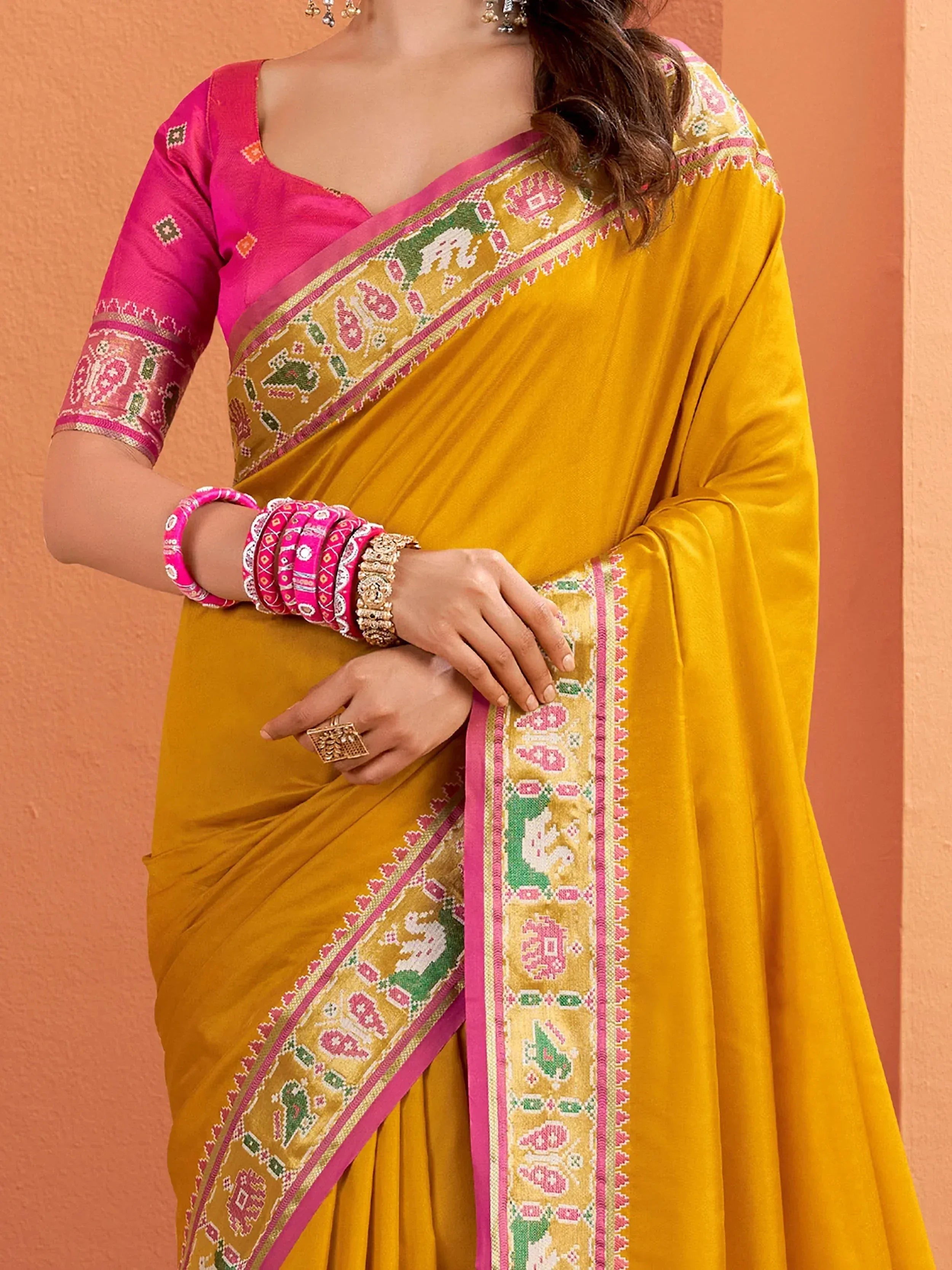 Yellow saree with pink blouse and elephant print border, Indian ethnic wear
