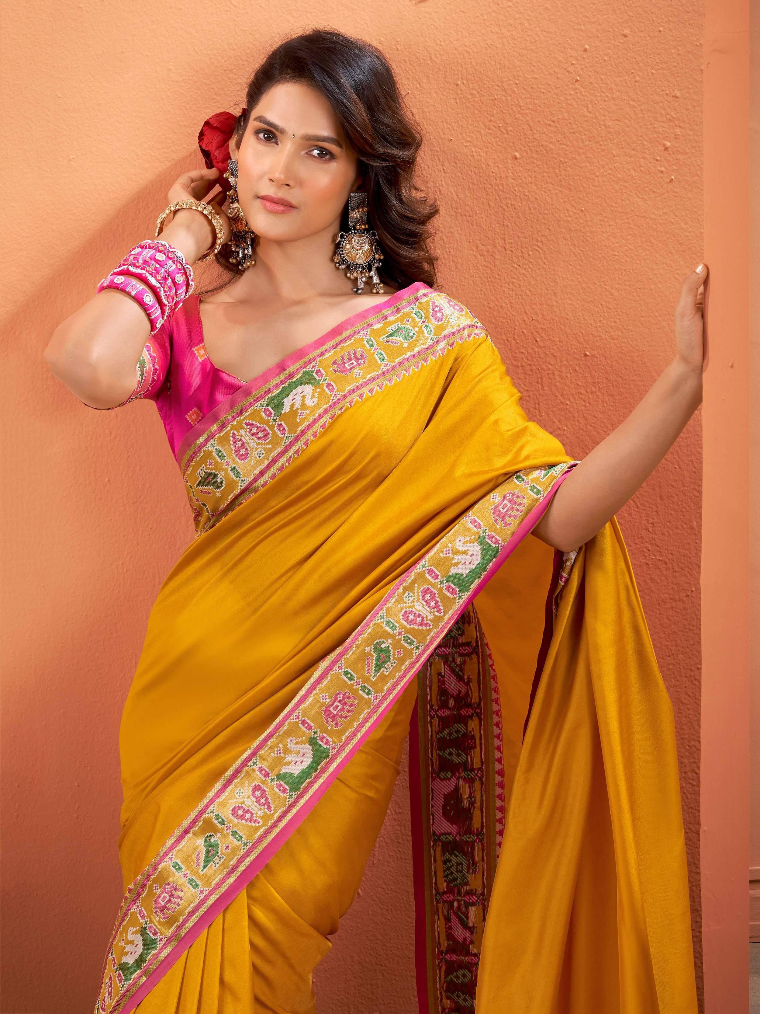 Yellow saree with pink blouse and elephant print border, Indian ethnic wear