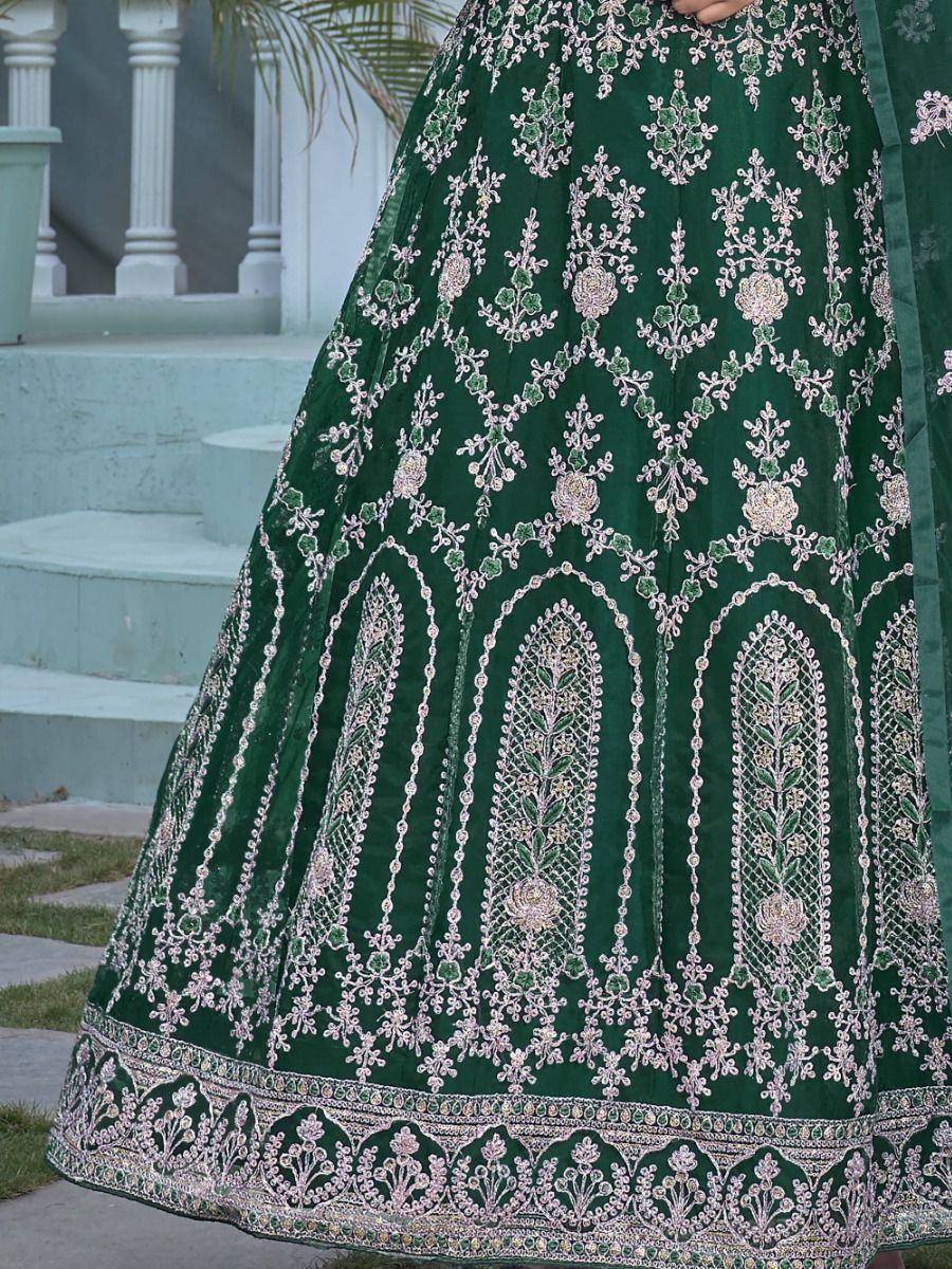 Emerald green lehenga with intricate floral embroidery and scalloped border, perfect for Indian ethnic wear