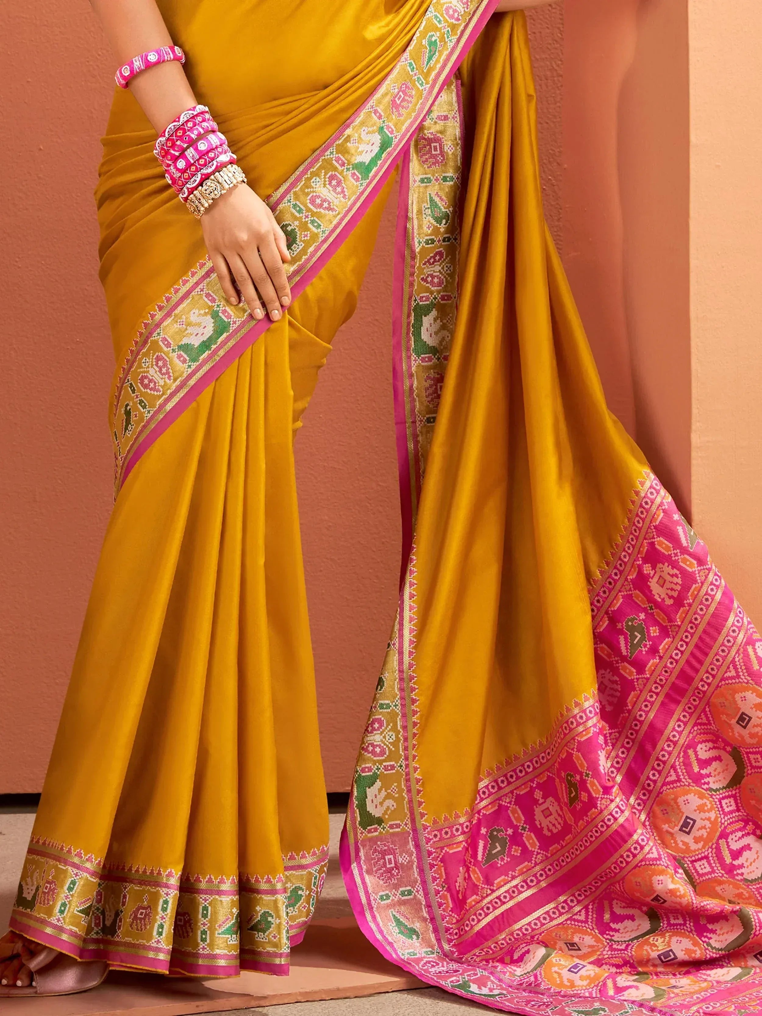 Mustard yellow saree with pink and green elephant border, Indian ethnic wear