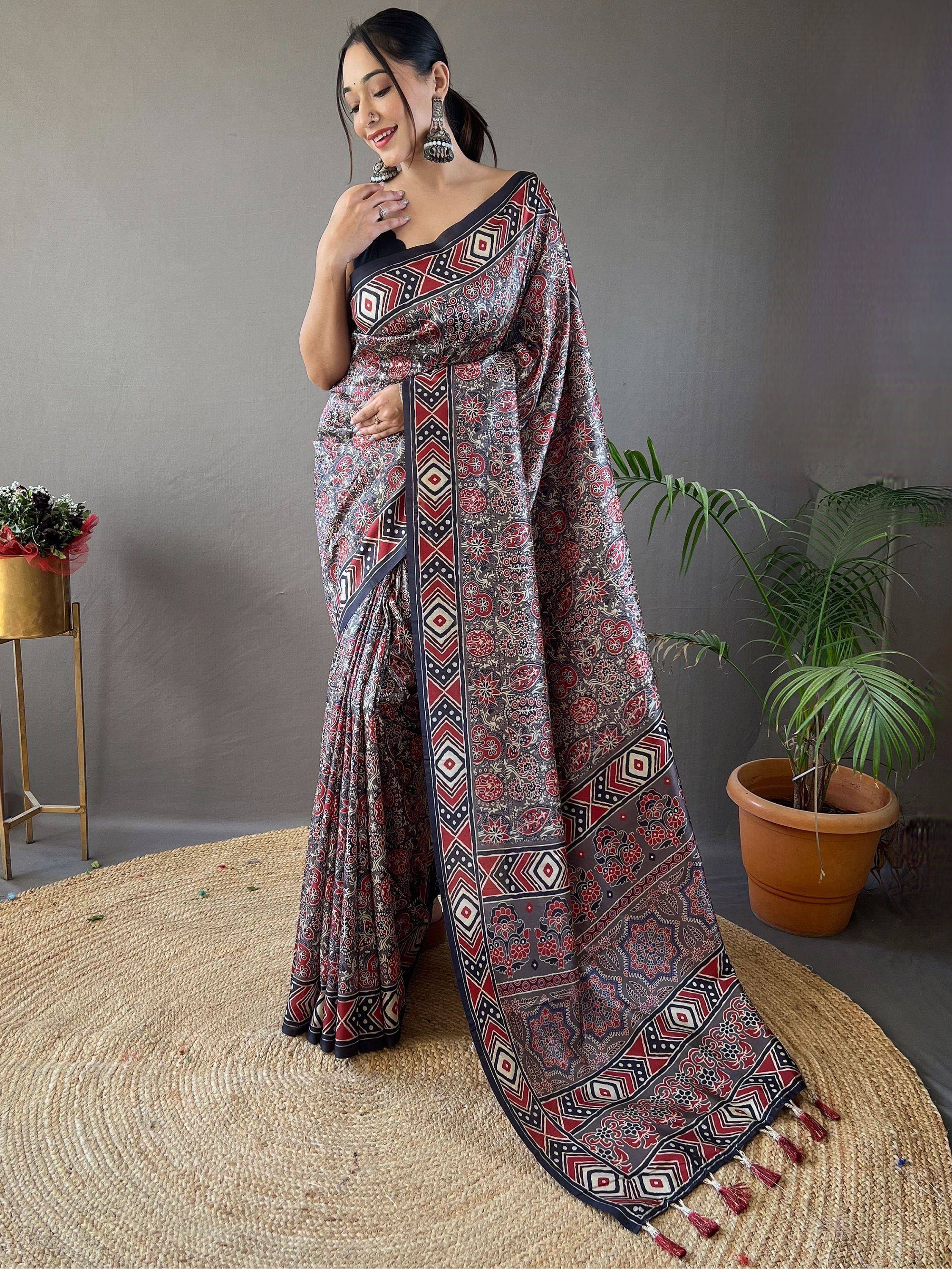Woman in elegant printed saree with geometric and floral motifs, perfect for Indian ethnic wear occasions