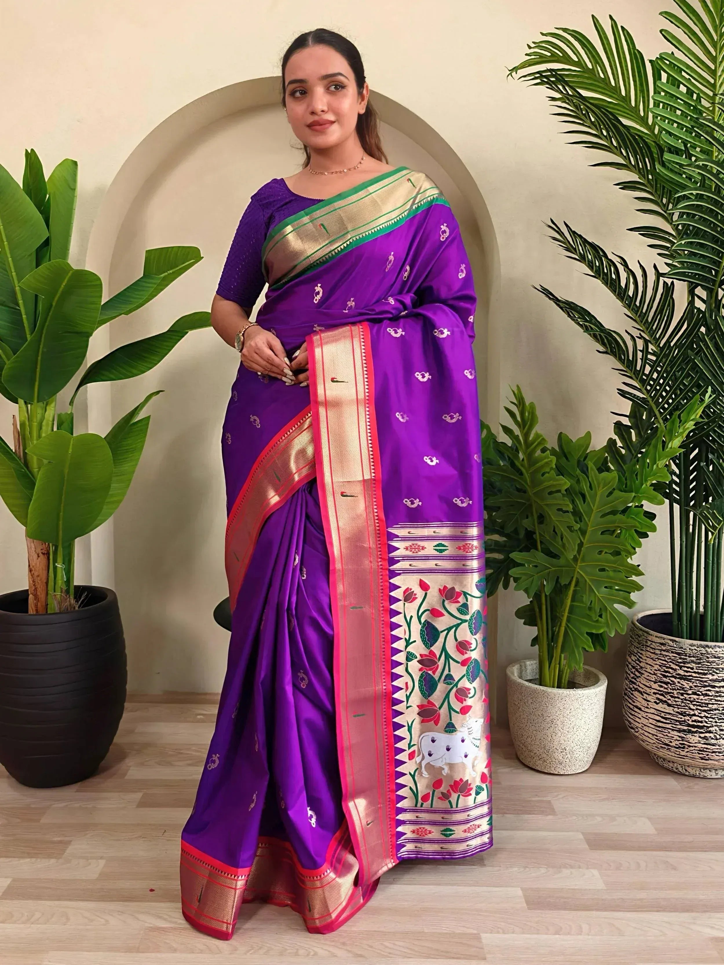 Purple silk saree with floral and cow motif border, gold zari, perfect for Indian ethnic wear