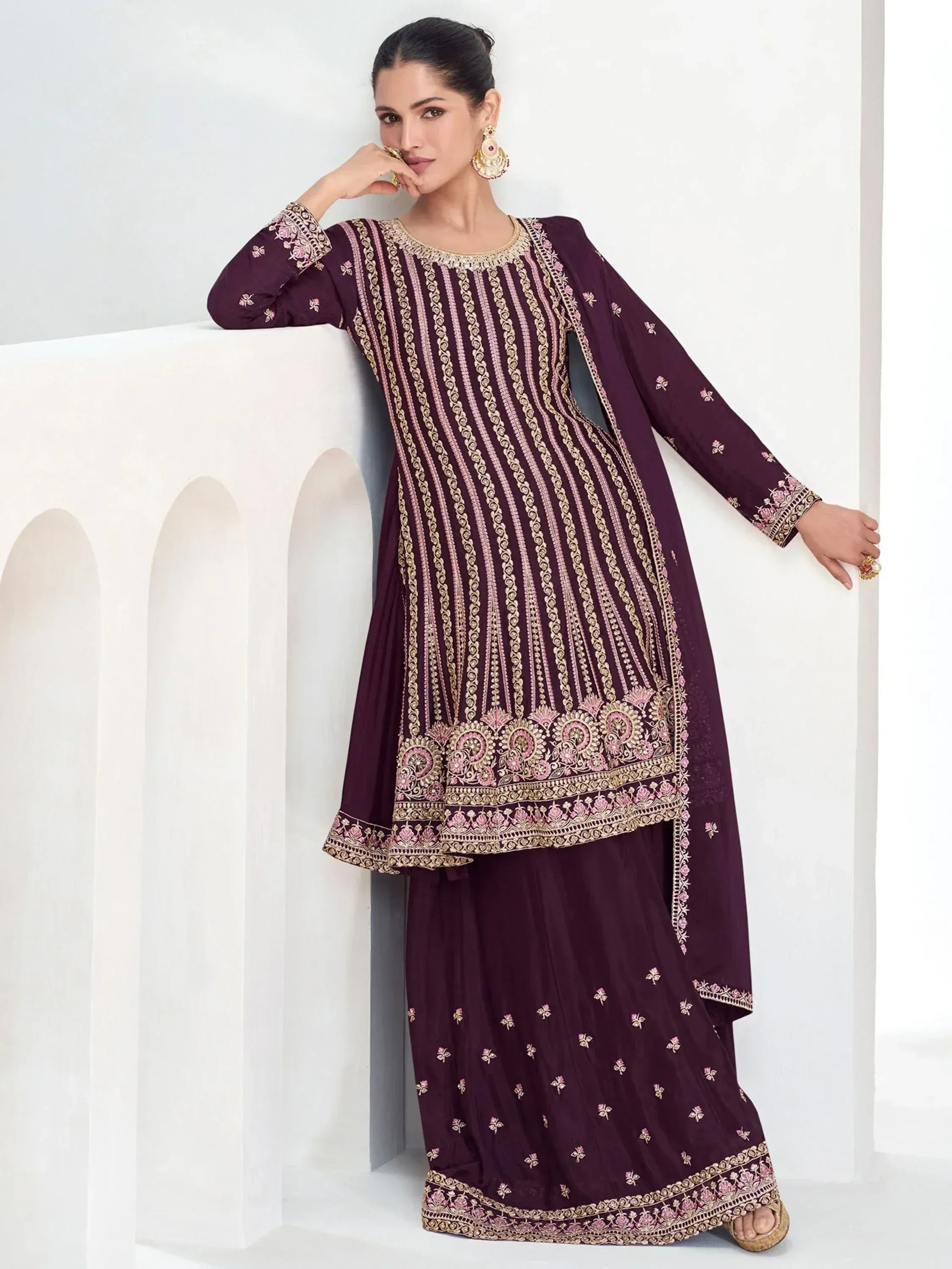 Elegant maroon embroidered salwar kameez with gold and pink detailing, perfect for Indian ethnic wear