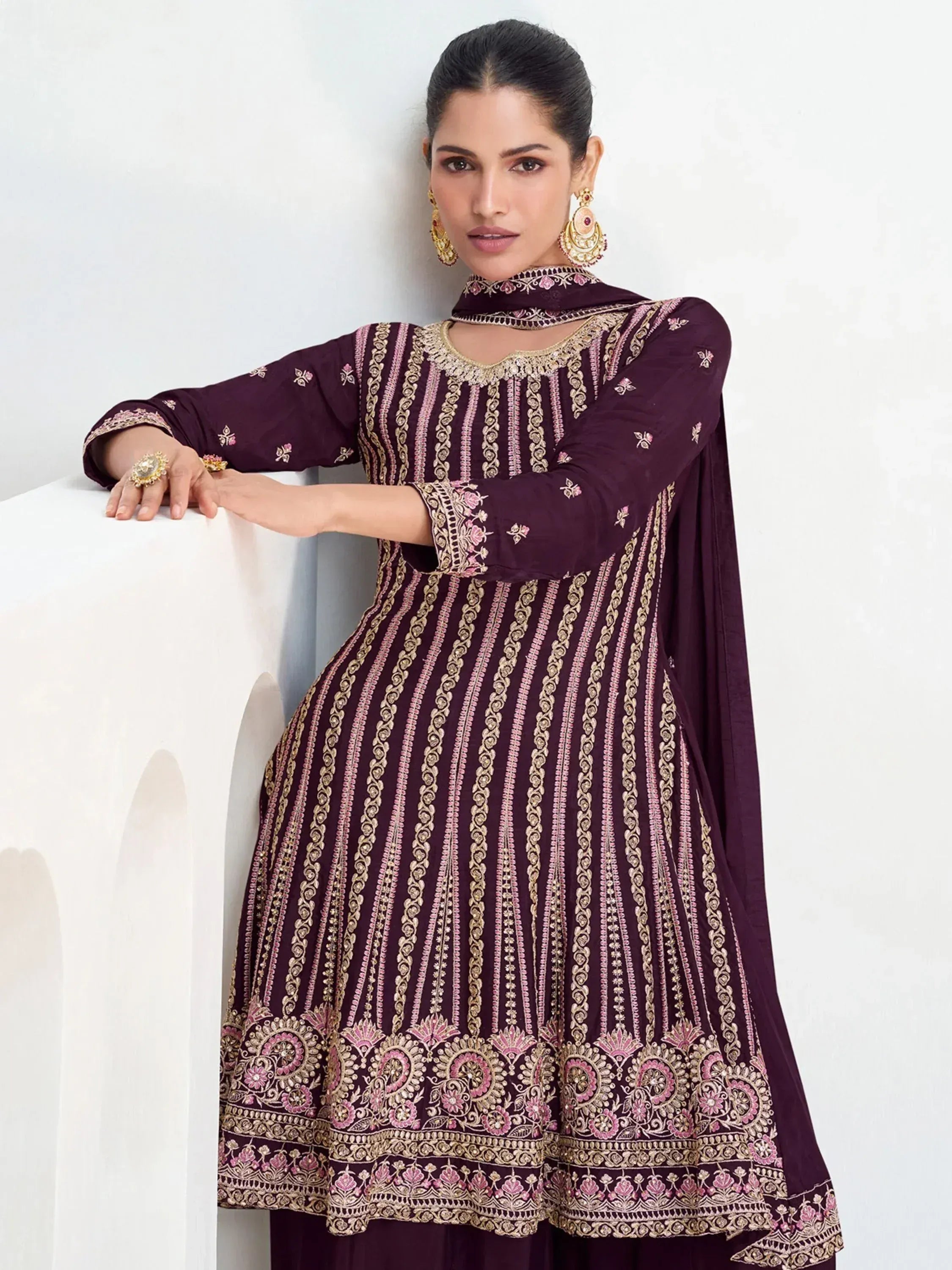 Elegant maroon embroidered anarkali suit with gold and pink detailing, perfect for Indian ethnic wear occasions.