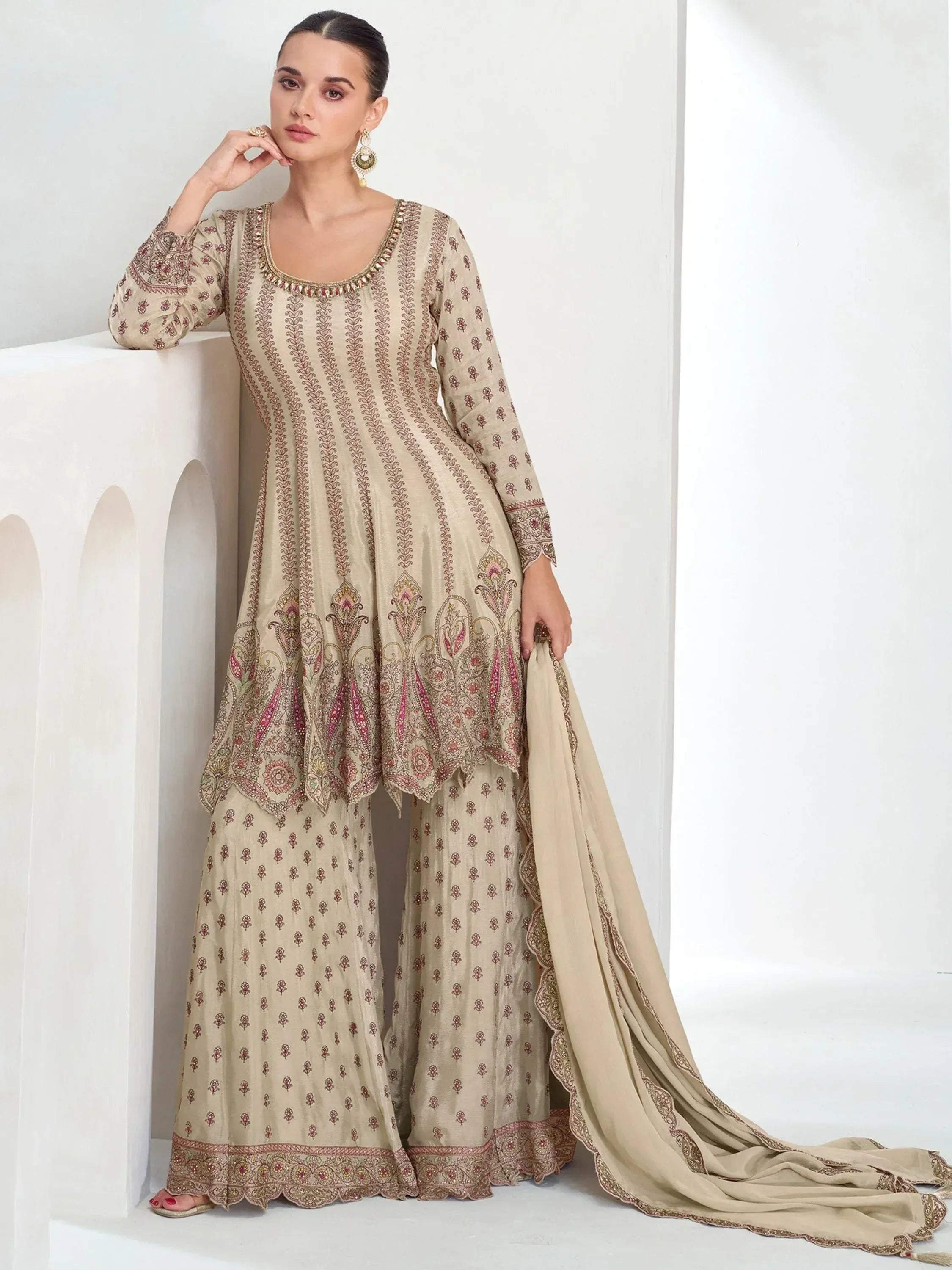 Beige embroidered salwar kameez with paisley design, perfect for Indian ethnic wear occasions