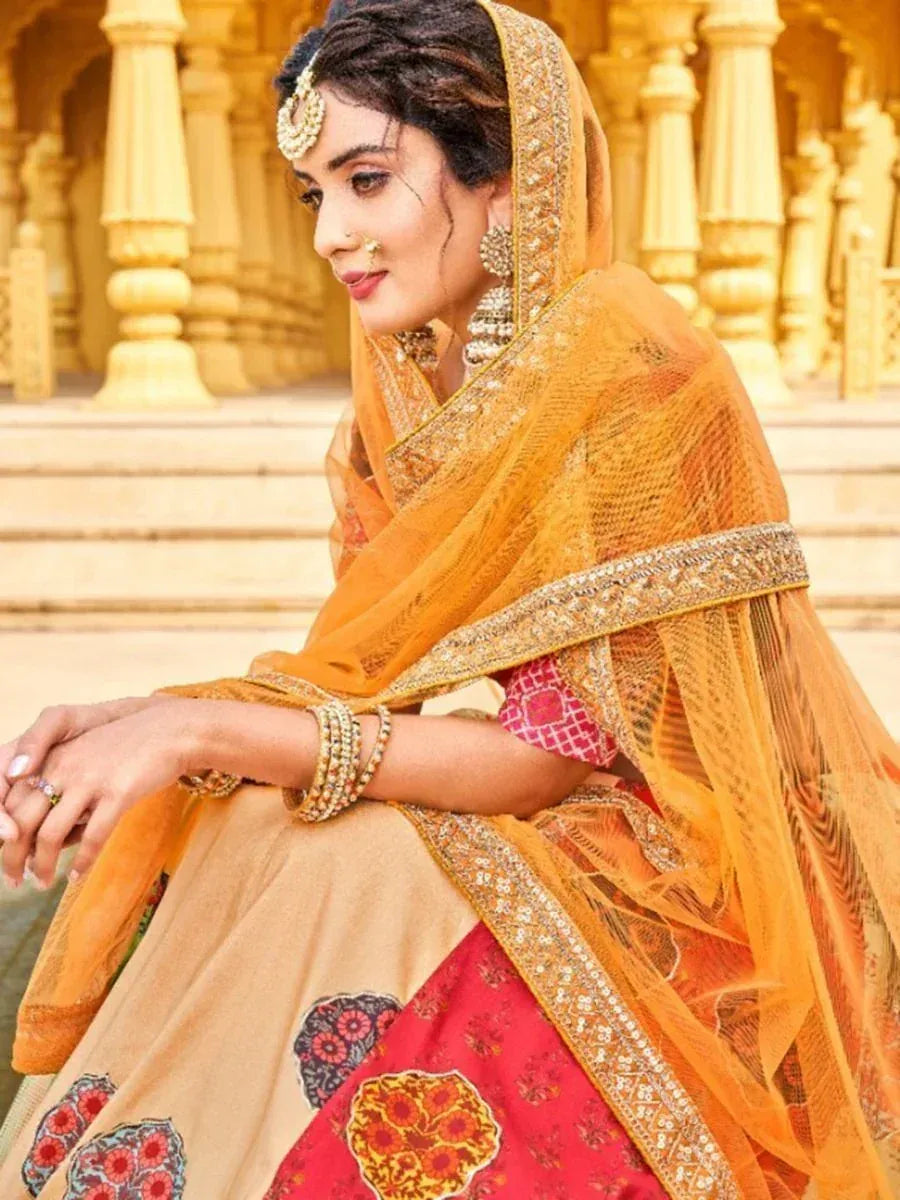 Elegant Indian bridal lehenga choli with floral prints, gold embroidery, and sheer dupatta, perfect for weddings.