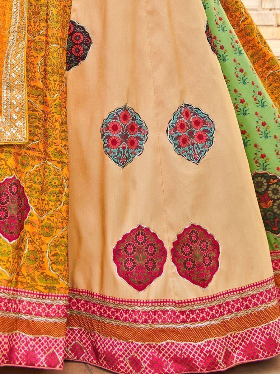 Beige lehenga with floral embroidery, pink border, and vibrant Indian ethnic wear designs