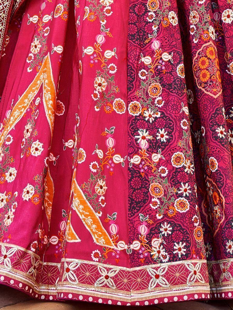 Vibrant pink lehenga with floral prints and orange border, ethnic Indian wear