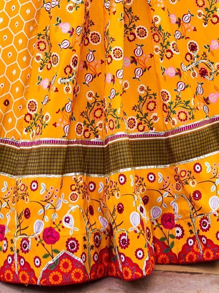 Vibrant yellow floral lehenga with intricate embroidery and border detailing, perfect for ethnic occasions.