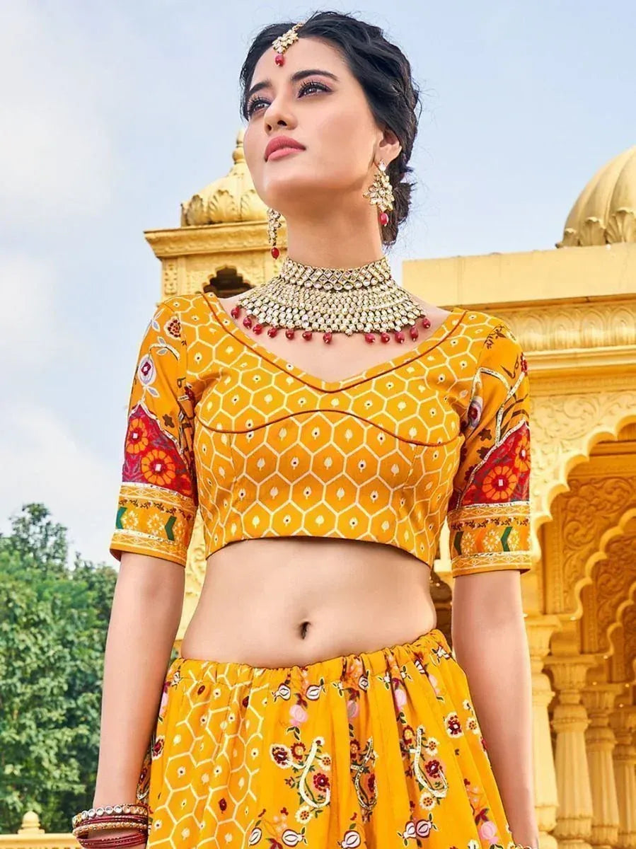 Yellow printed lehenga choli with floral motifs, traditional Indian ethnic wear for women