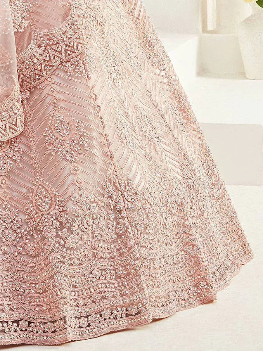 Pink embroidered lehenga choli with intricate beadwork and lace detailing, perfect for Indian ethnic wear