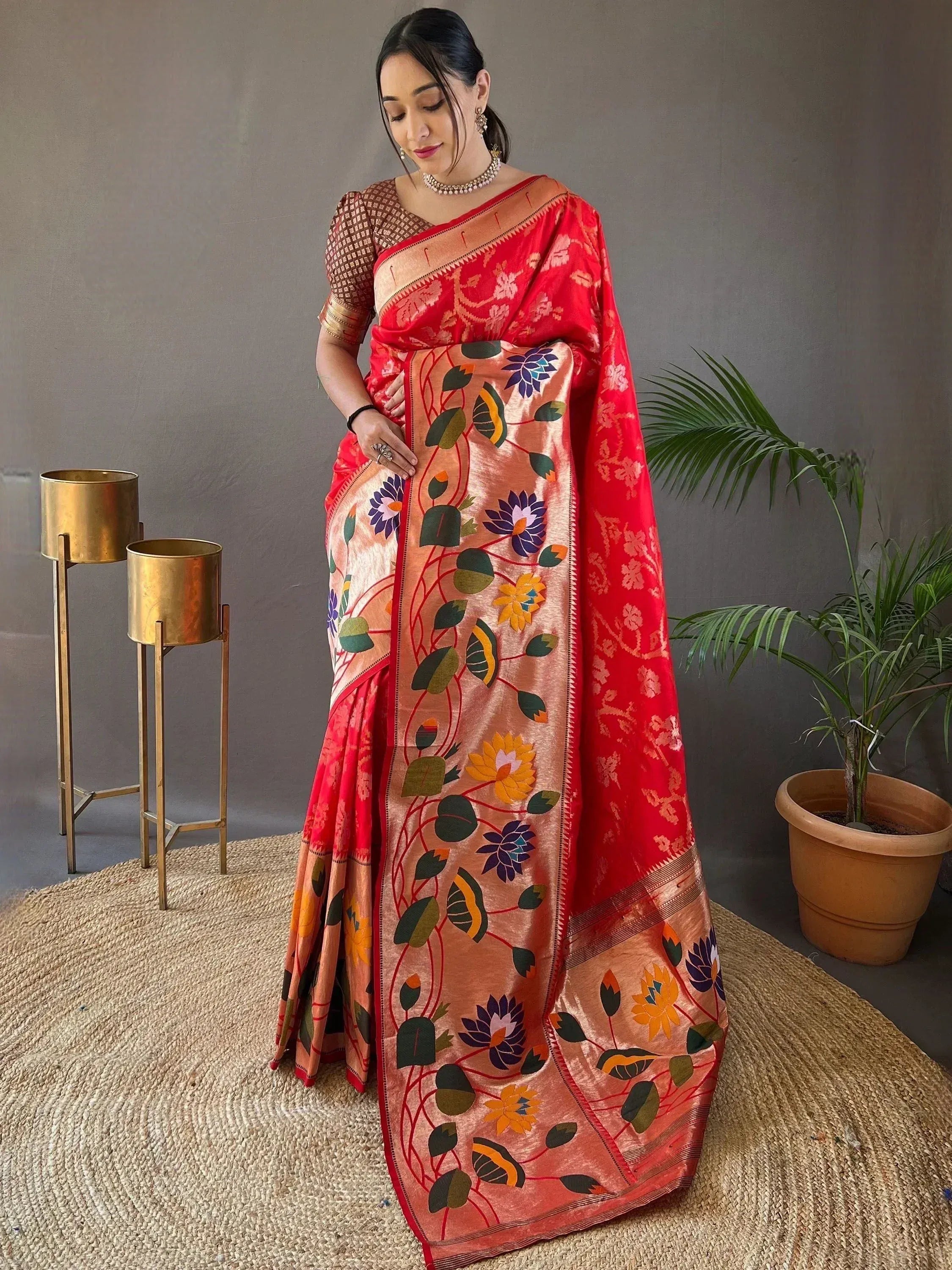 Red and peach floral saree with intricate embroidery, perfect for ethnic occasions