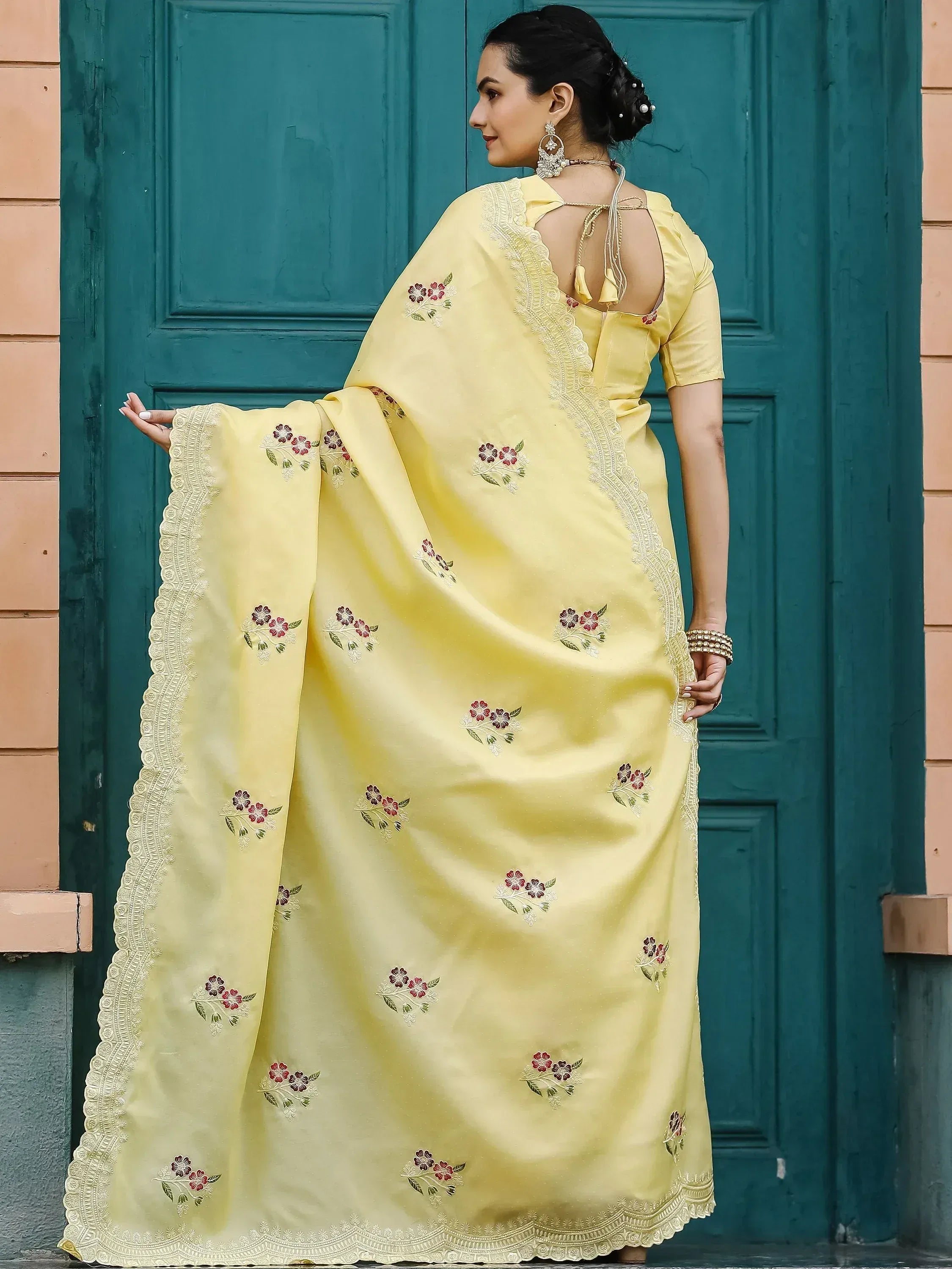 Yellow floral embroidered saree with lace border, back view, ethnic Indian wear