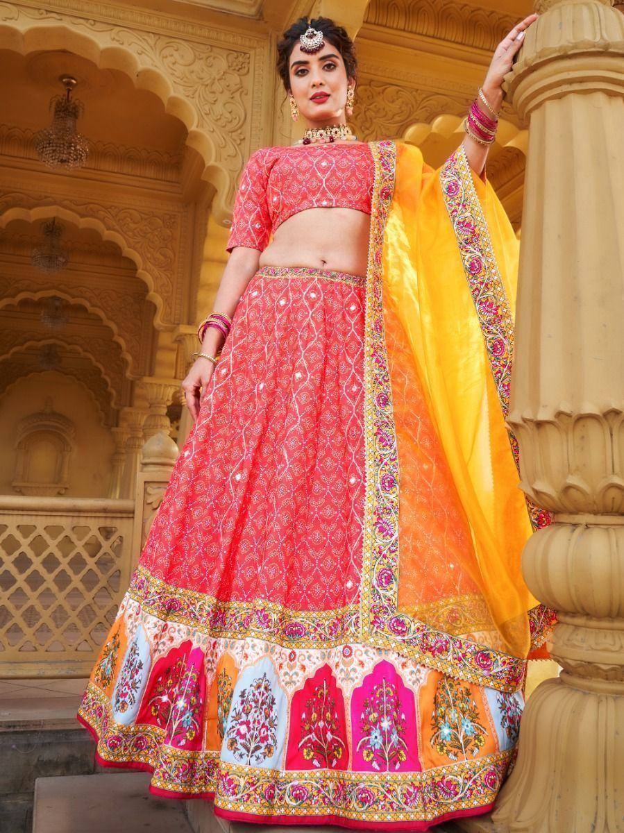 Pink embroidered lehenga choli with yellow dupatta, traditional Indian ethnic wear for weddings and festivals