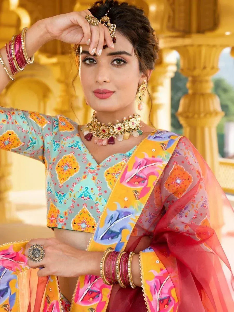 Woman in colorful Indian ethnic wear with floral lehenga choli, traditional jewelry, and bangles