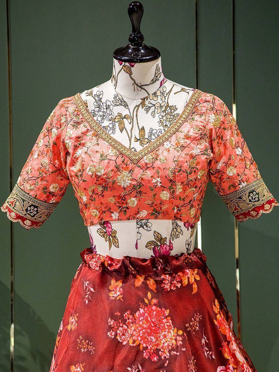 Floral print Indian lehenga choli with gold trim, displayed on mannequin