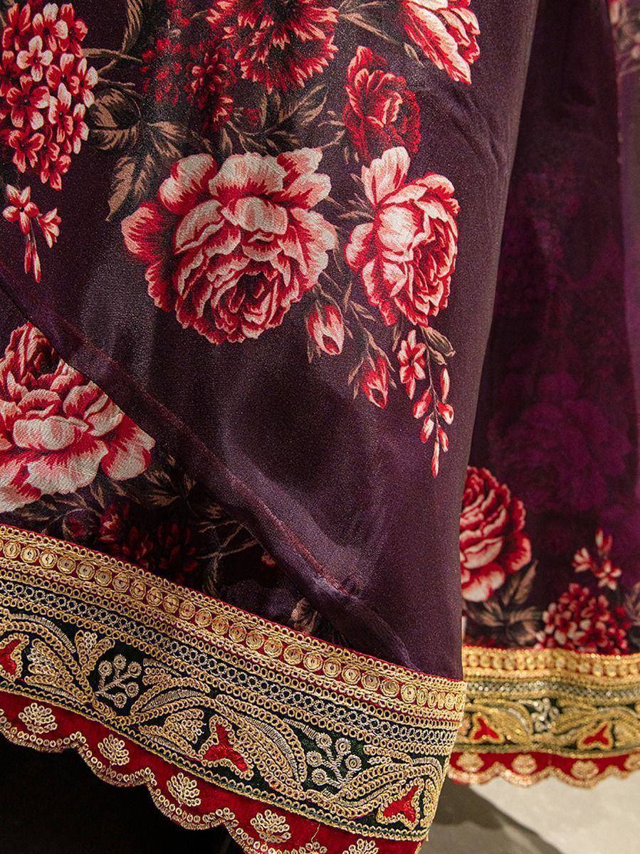 Elegant ethnic gown with red floral print and gold embroidered border, perfect for Indian occasions