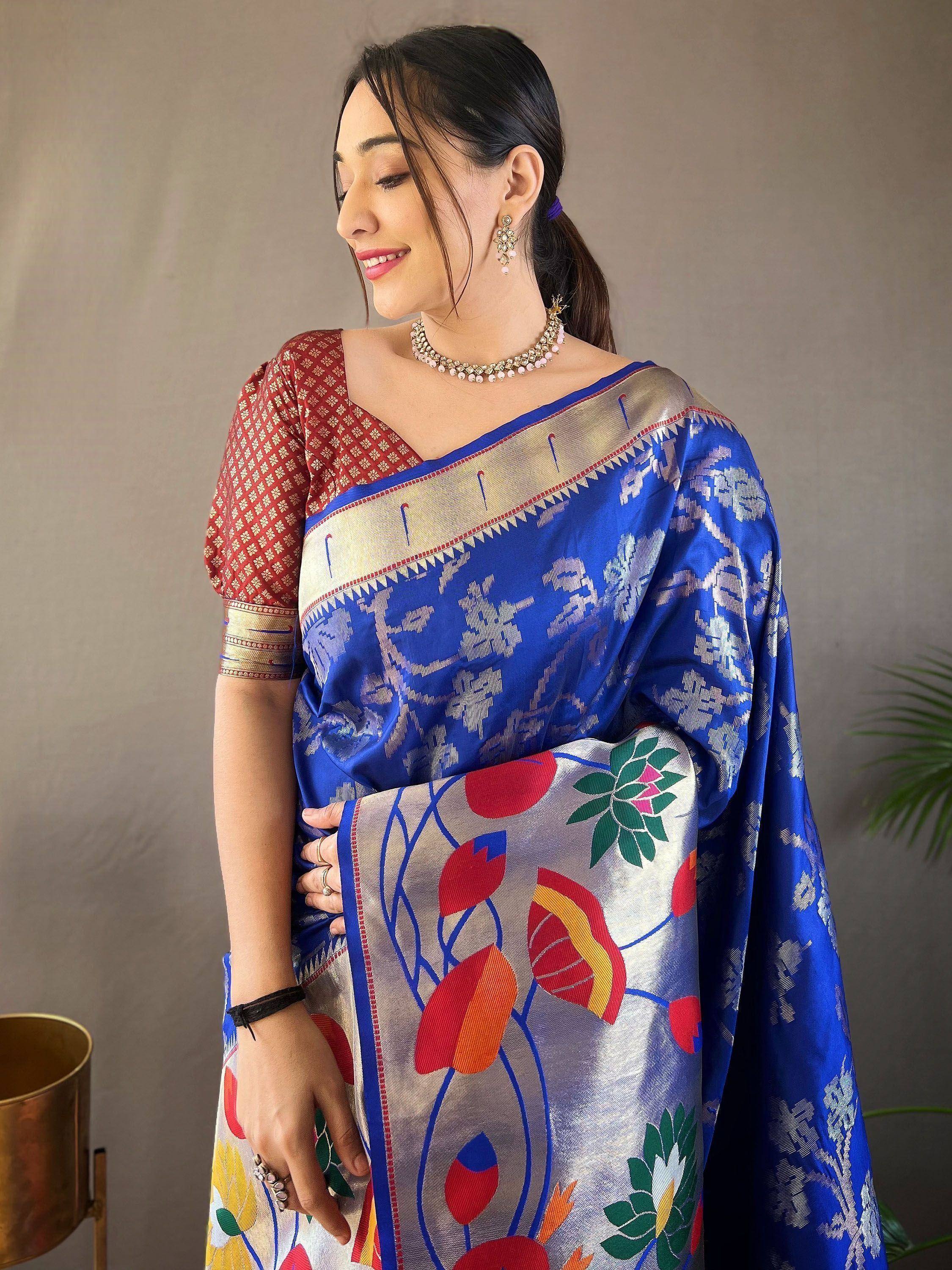 Woman in blue floral saree with red blouse, ethnic Indian wear, designer saree for festive occasions