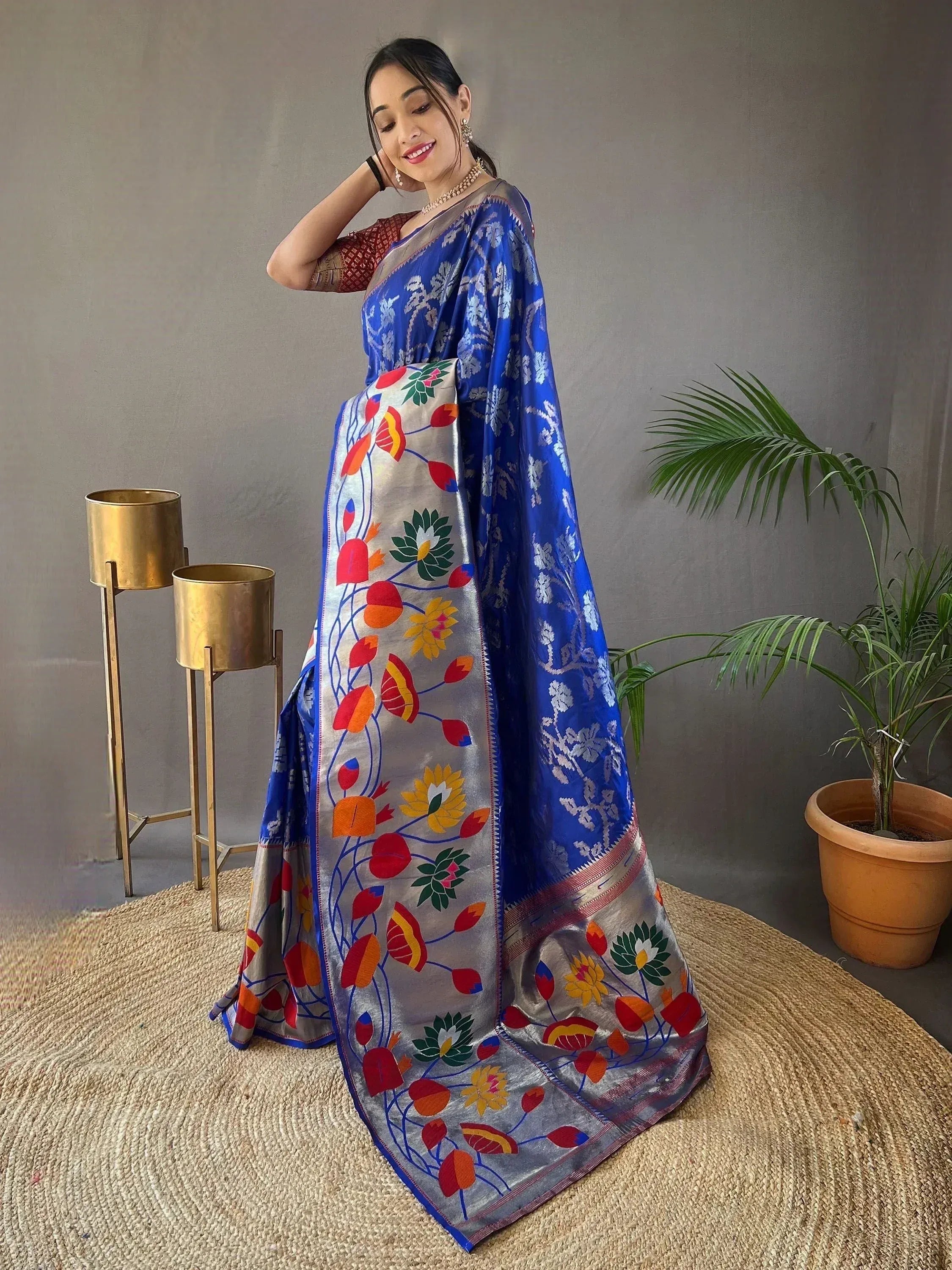 Blue and silver floral embroidered saree with vibrant lotus print, perfect for Indian ethnic occasions.