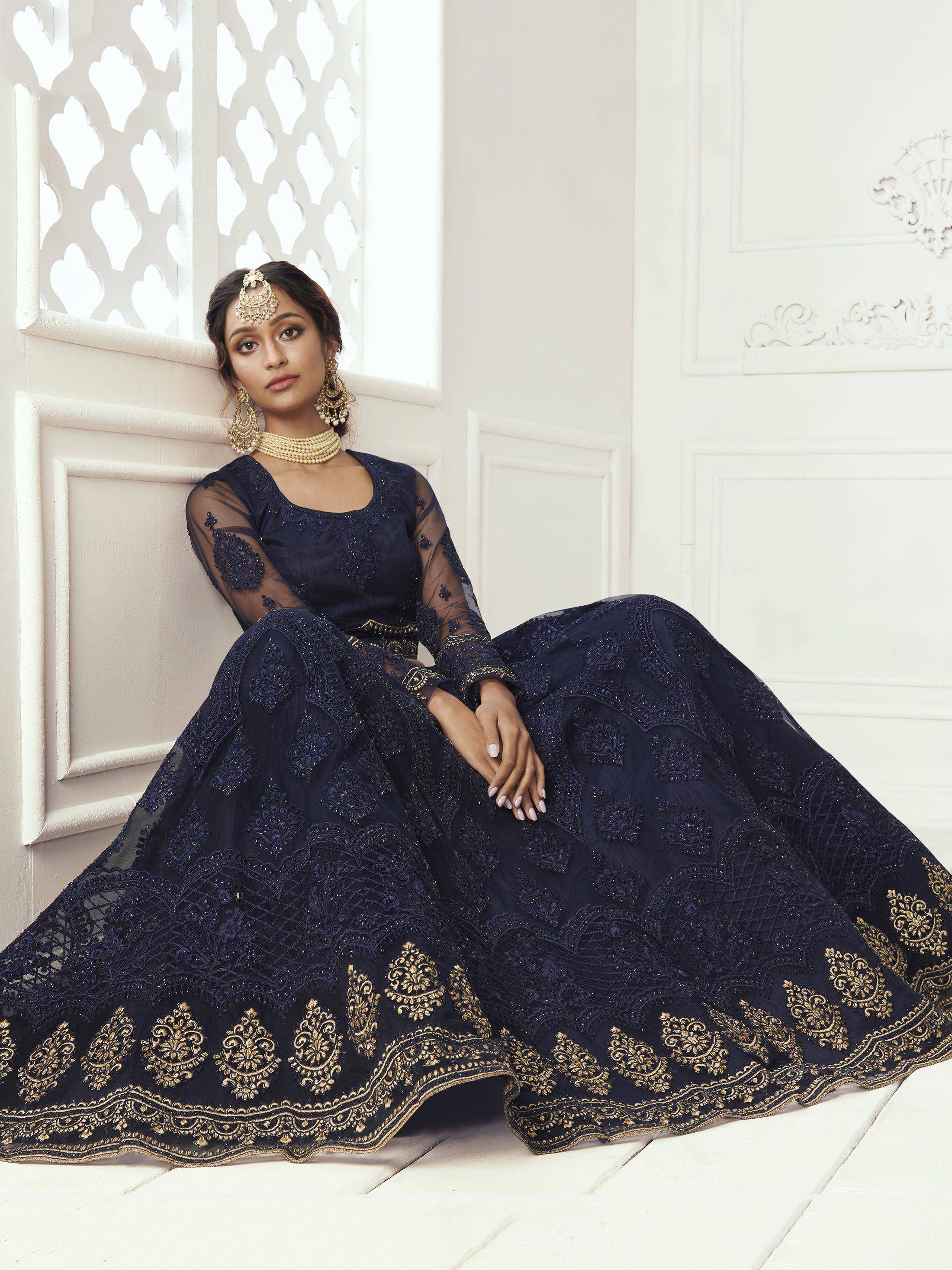 Navy blue embroidered lehenga choli with gold detailing, perfect for Indian weddings and festive occasions.