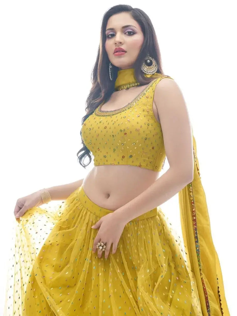 Delightful Mustard Yellow Ruffle Work Soft Net Lehenga Choli
